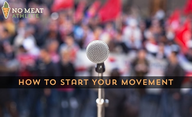 Microphone in focus against unrecognizable crowd of people
