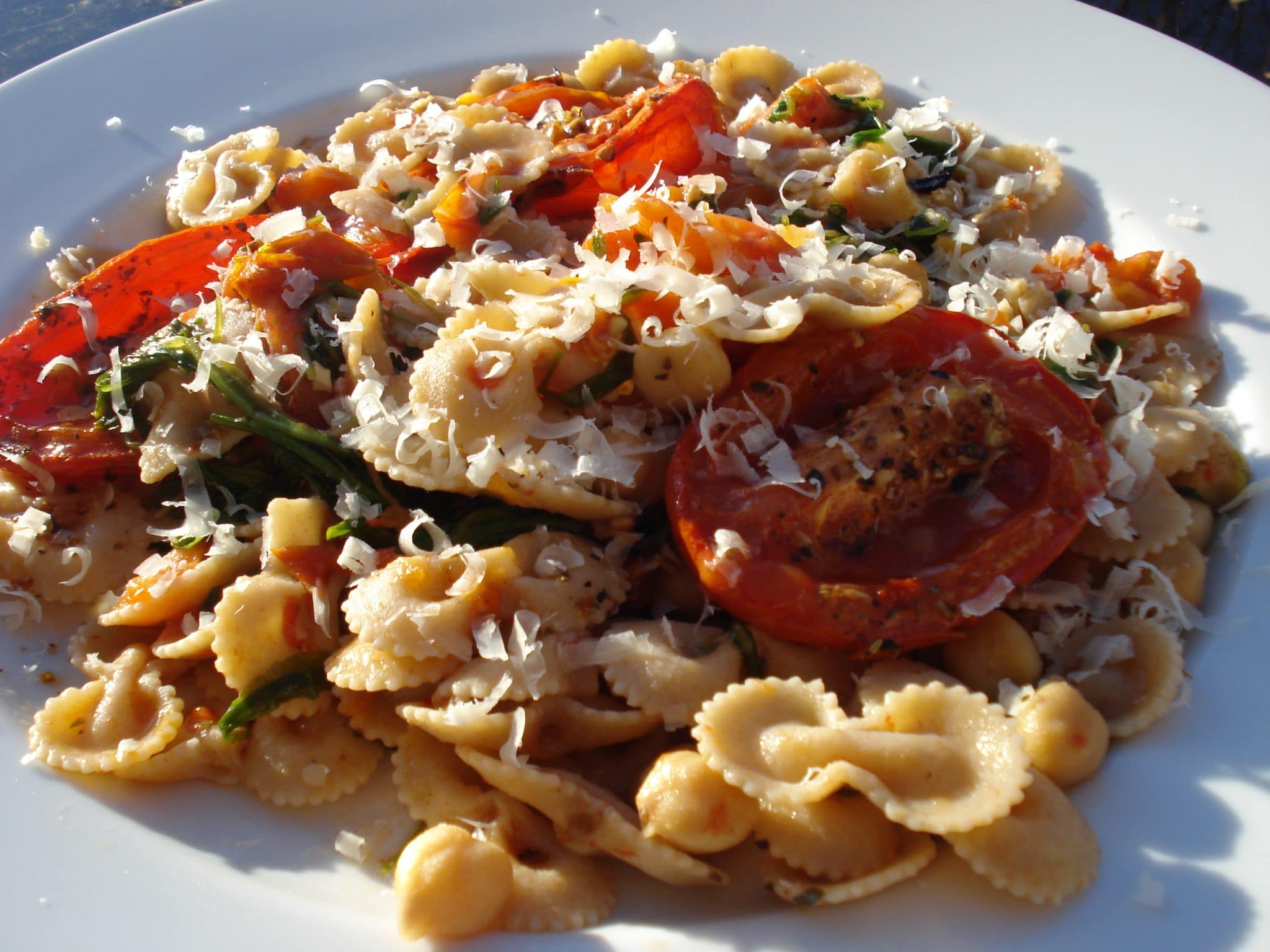 Plate of Fire Roasted Tomato Pasta with Chickpeas and Arugula