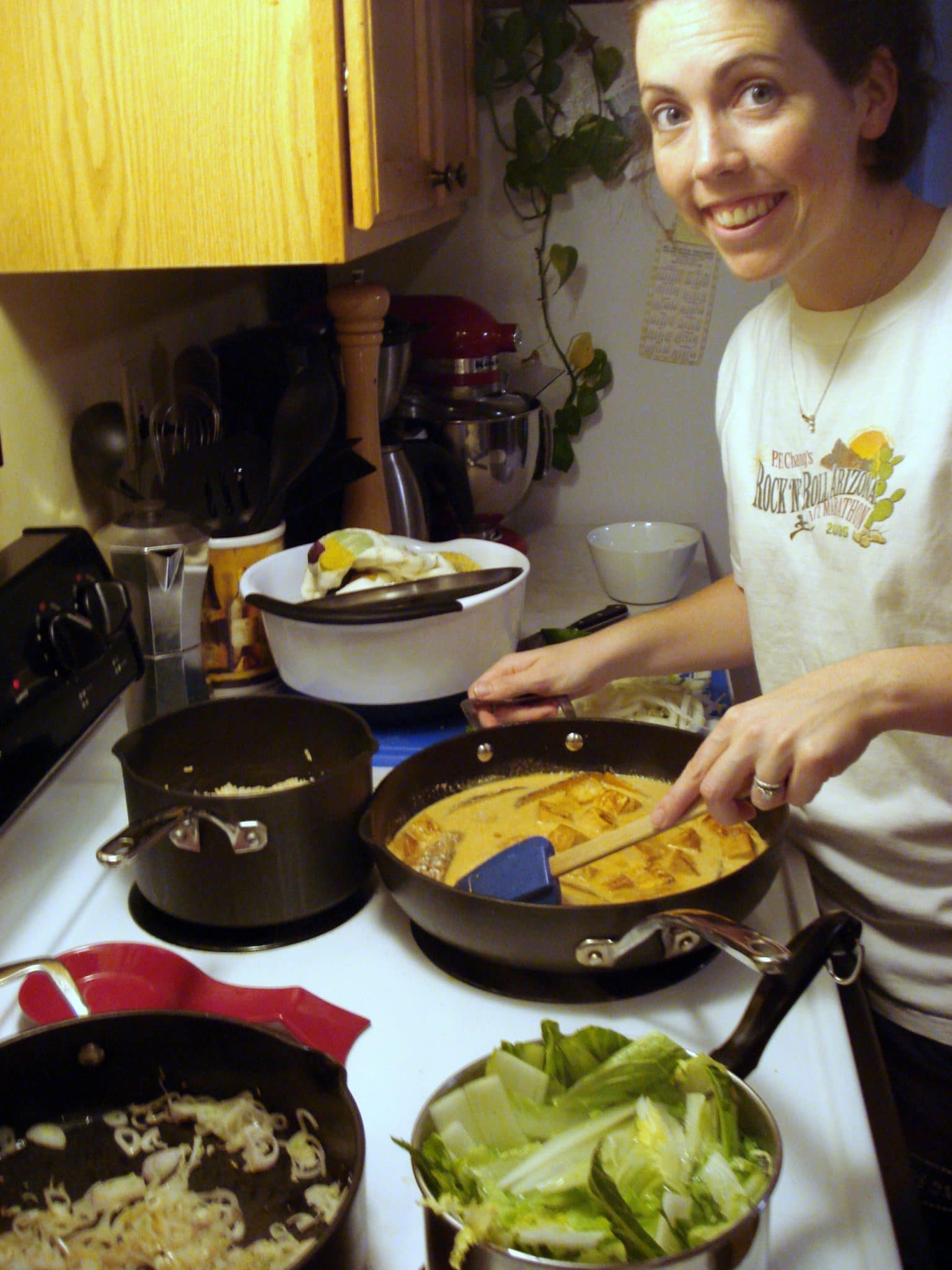 Woman cooking curry on stove top