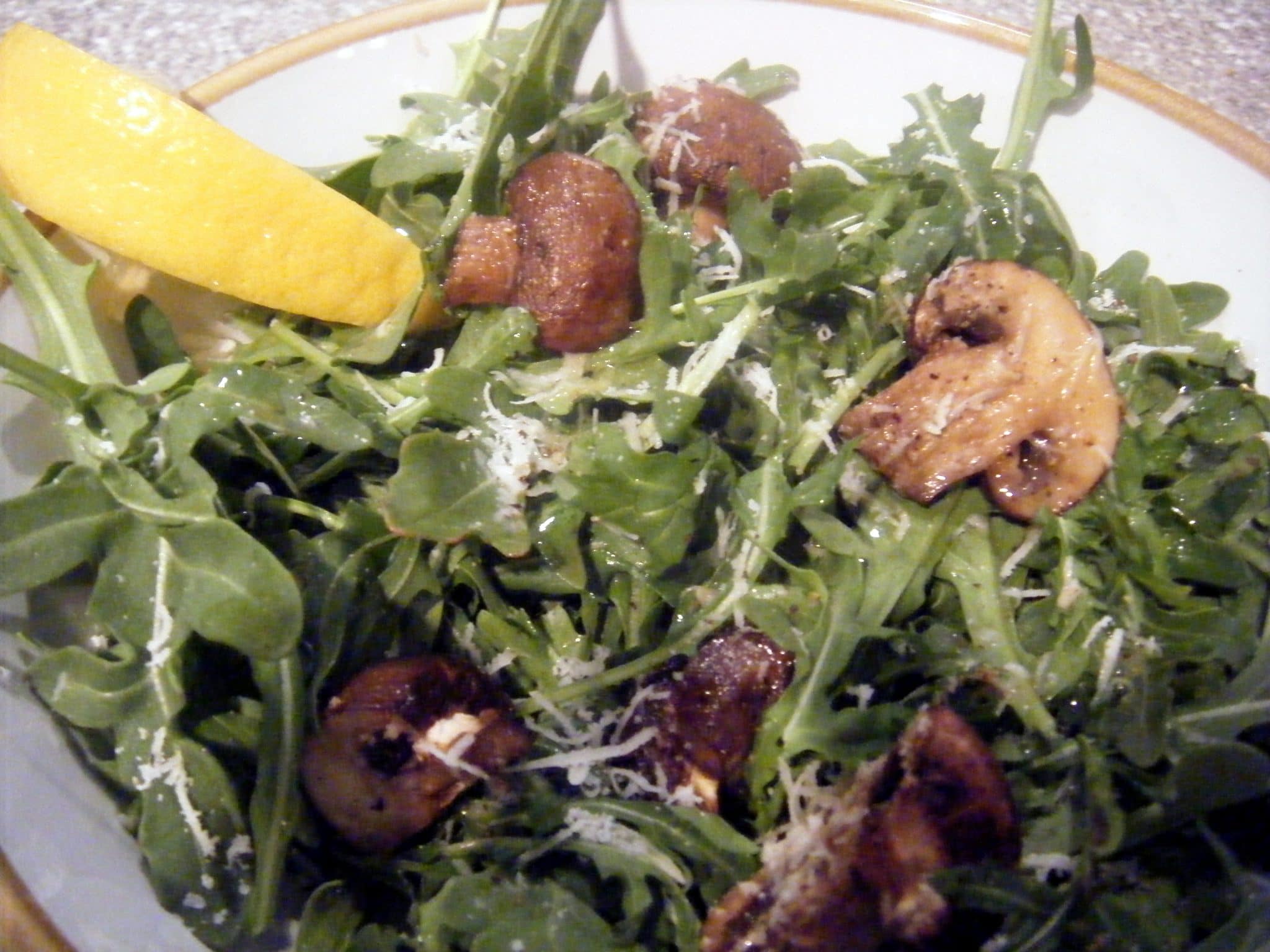 Fresh arugula salad with mushrooms