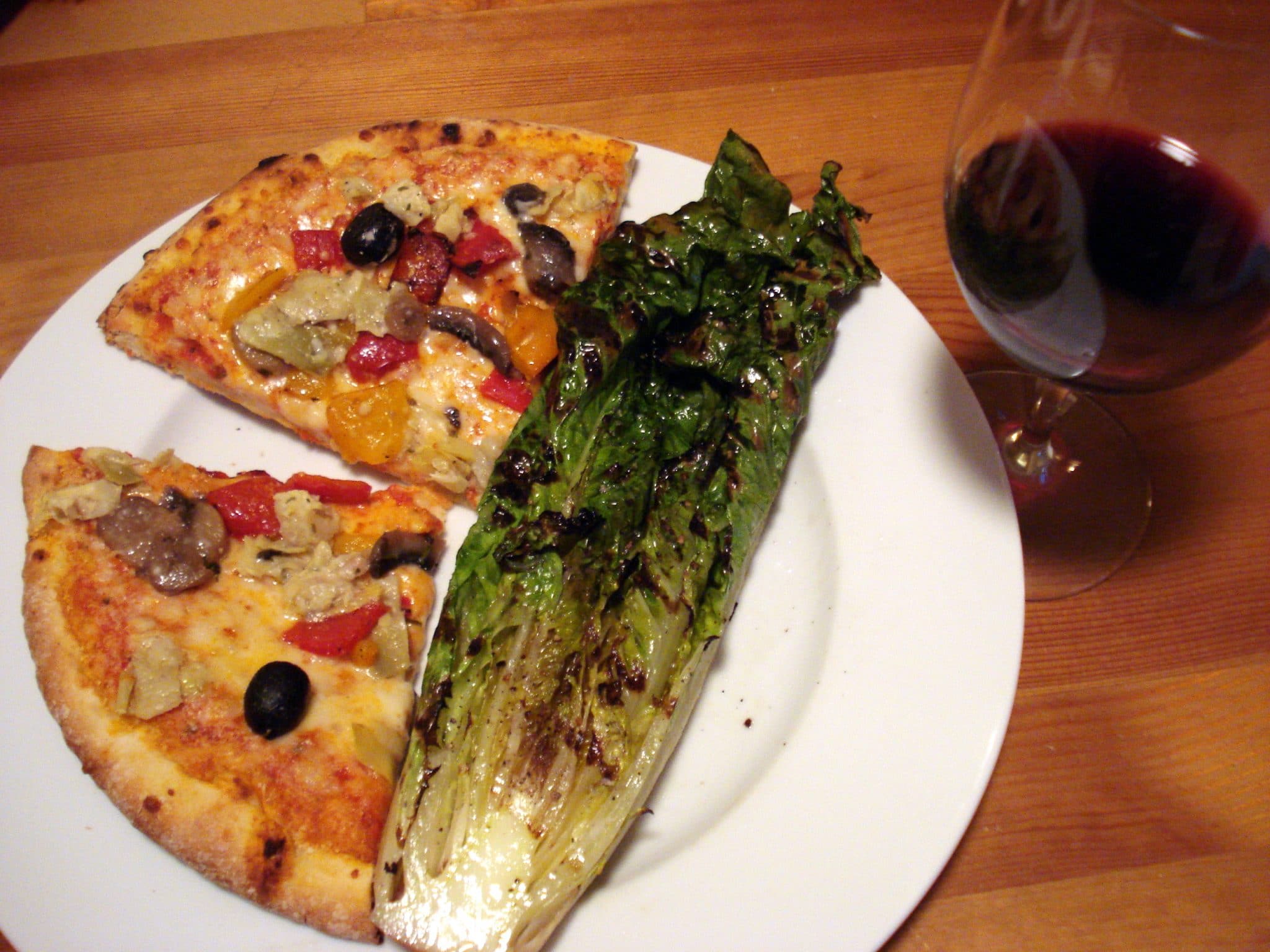 2 slices of Frozen Mediterranean Pizza with grilled Romaine and glass of Red wine