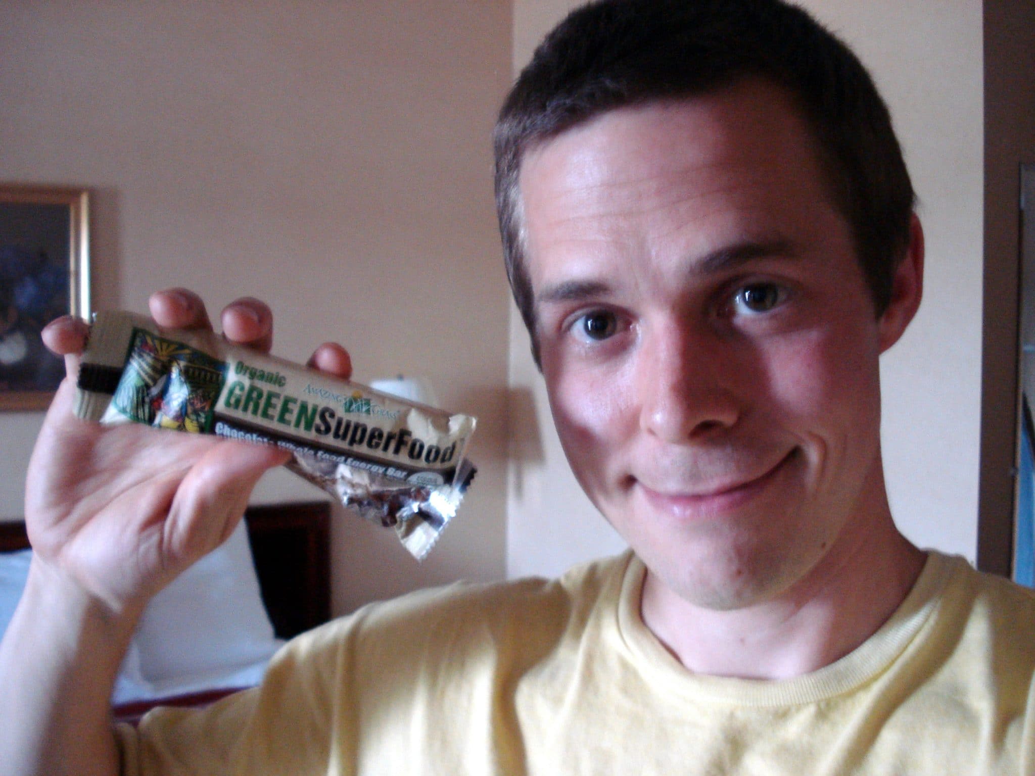 Man holding Amazing Grass Chocolate Green SuperFood bar