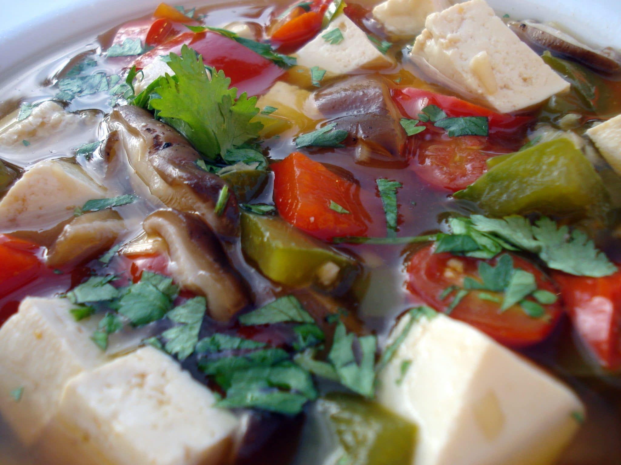 Close up of Thai Lemongrass Soup with mushrooms and tofu