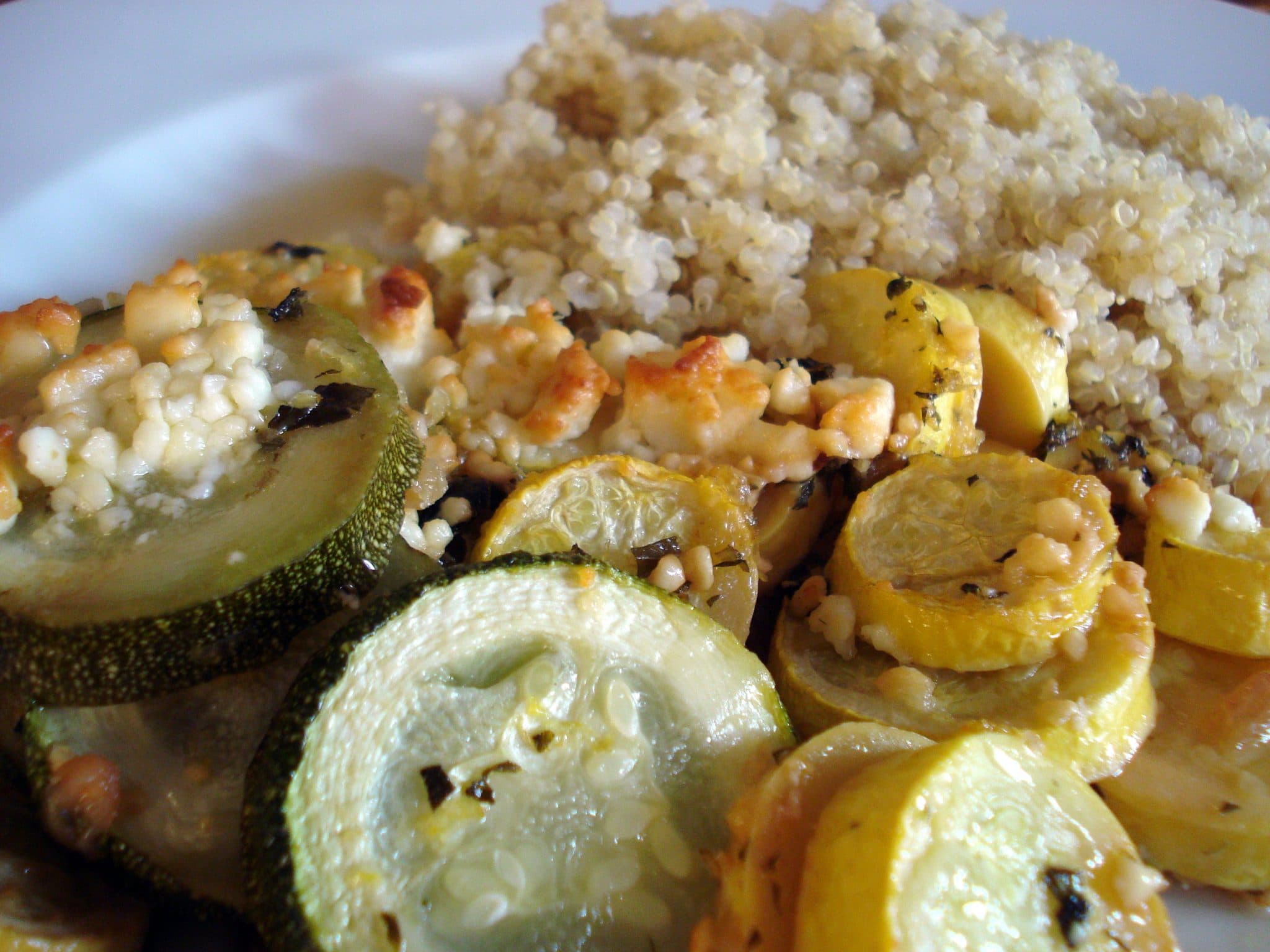 Roasted squash and zucchini on plate with quinoa