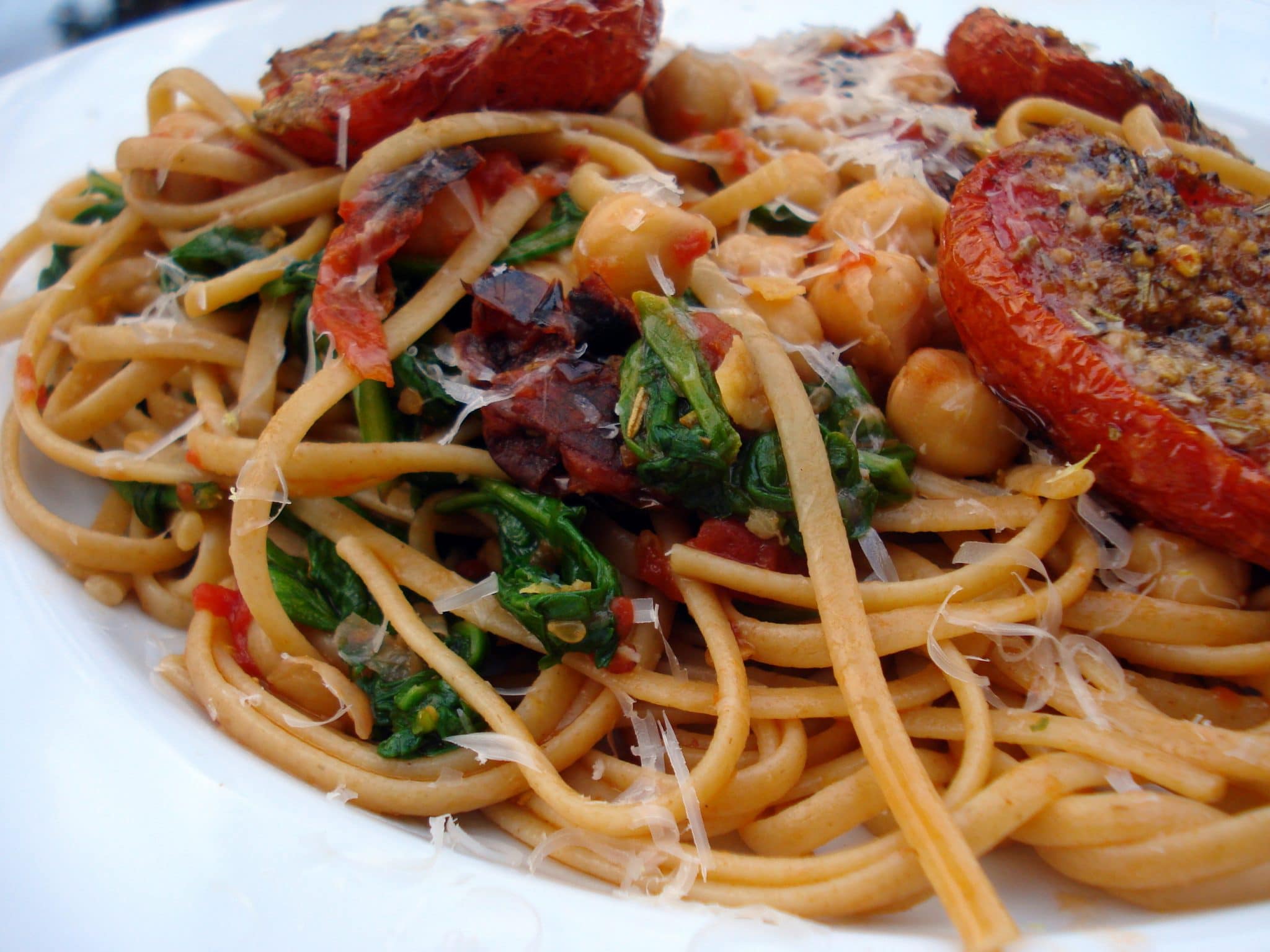 Tomato pesto pasta topped with chickpeas and tomatoes