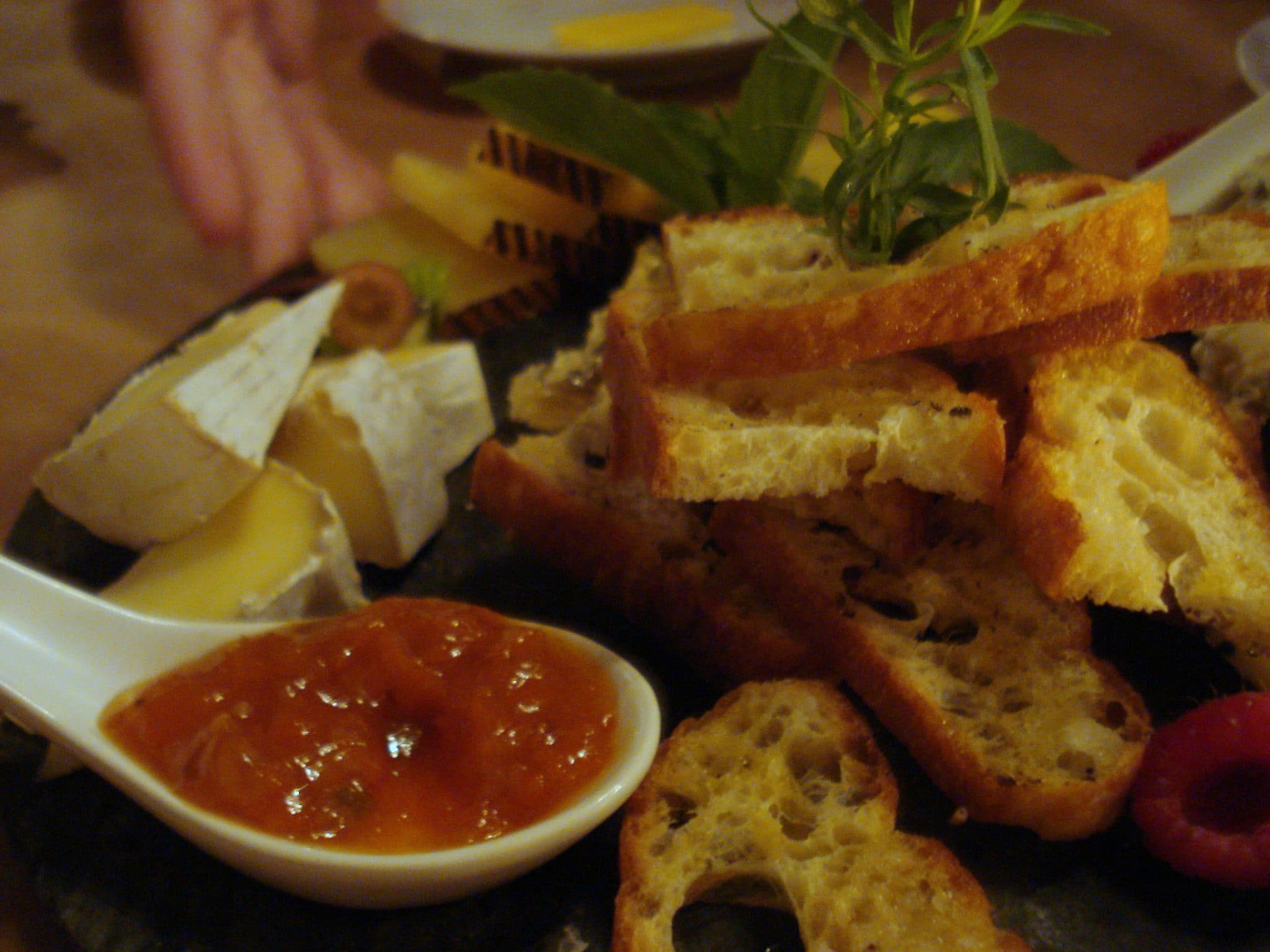 Bread and cheese plate with peach dipping sauce