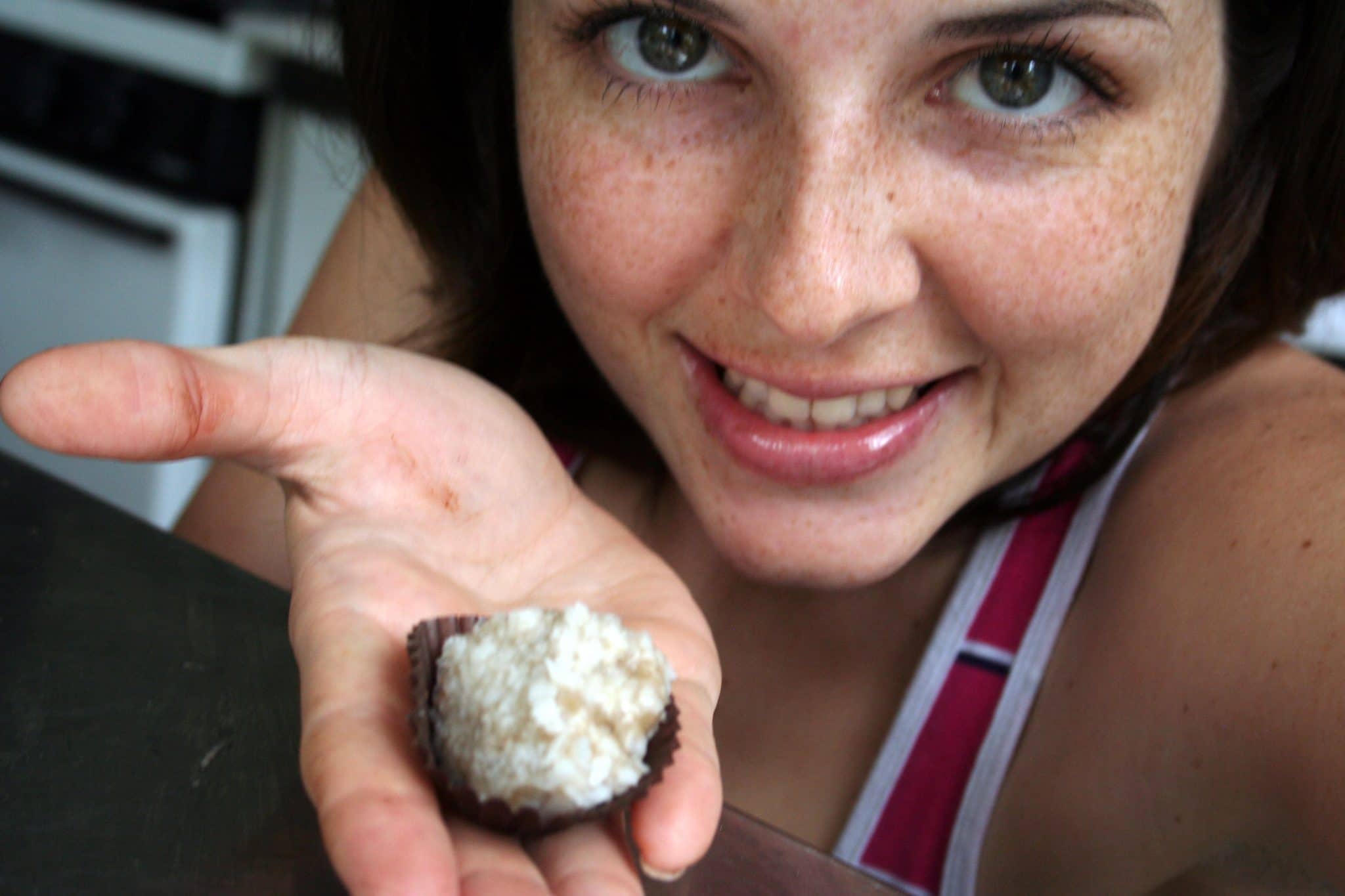 Woman holding banana truffle in hand