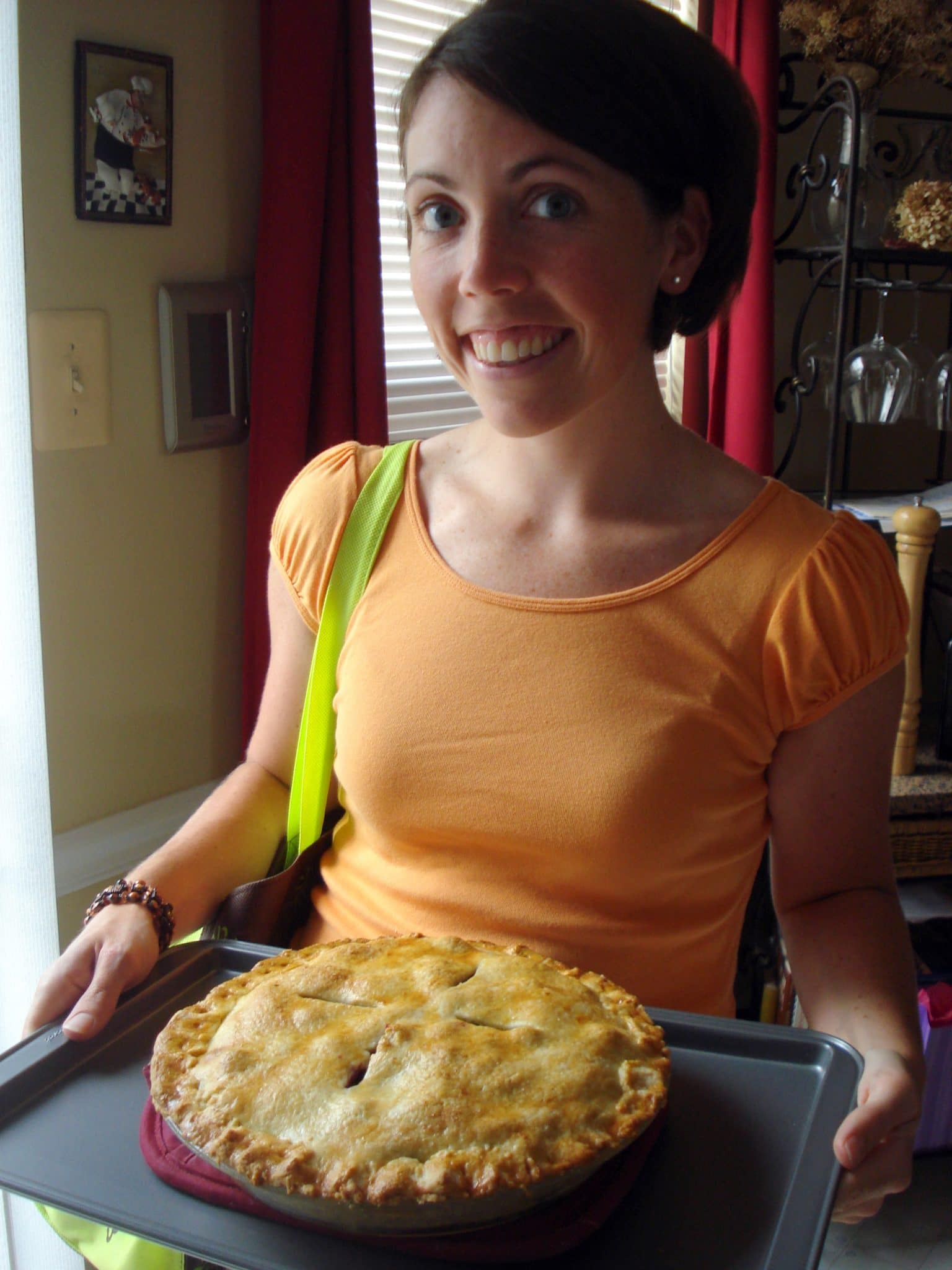 Woman holding blueberry peach vegan pie