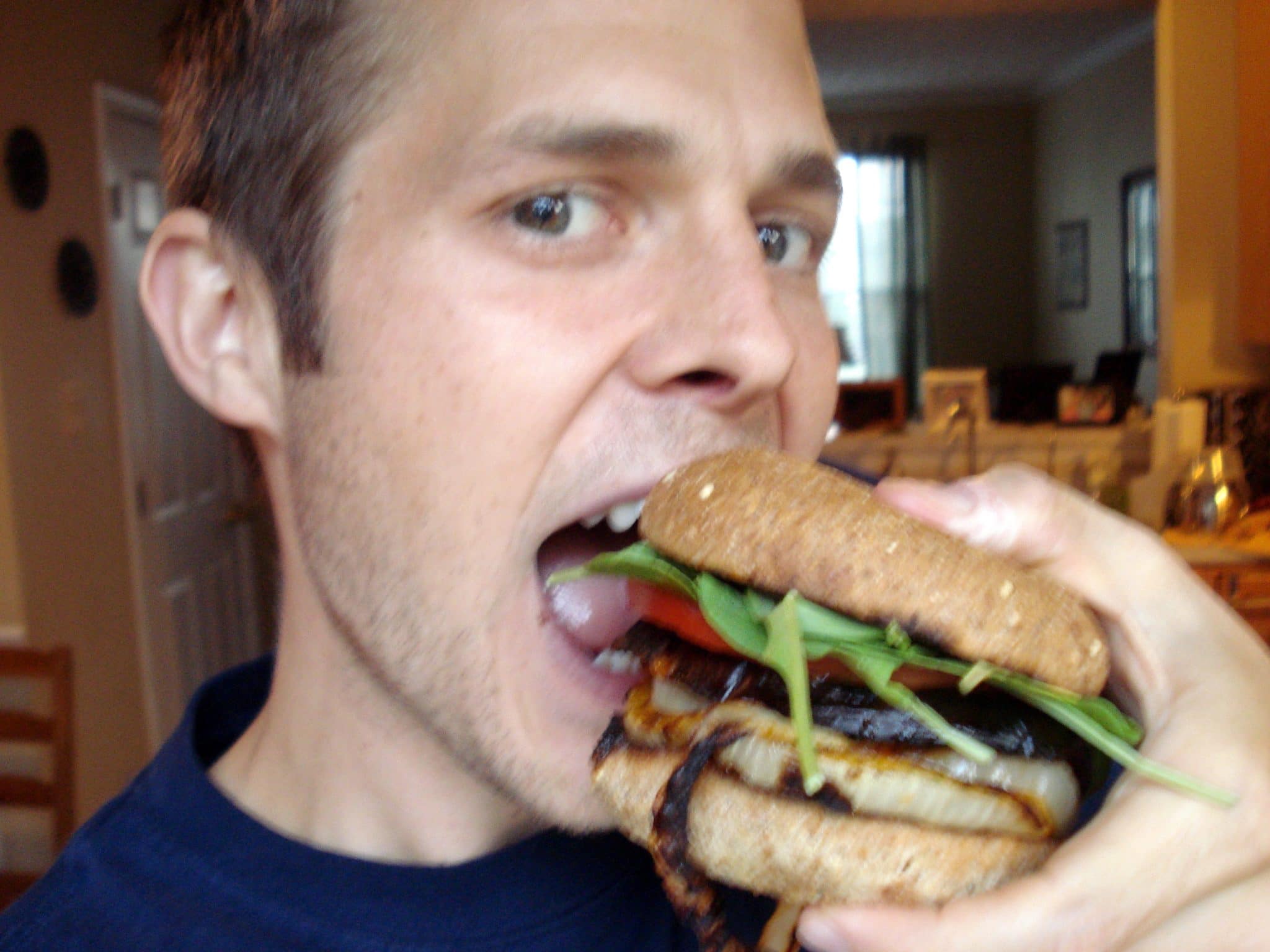 Matt eating Grilled Onion and Eggplant Sandwich