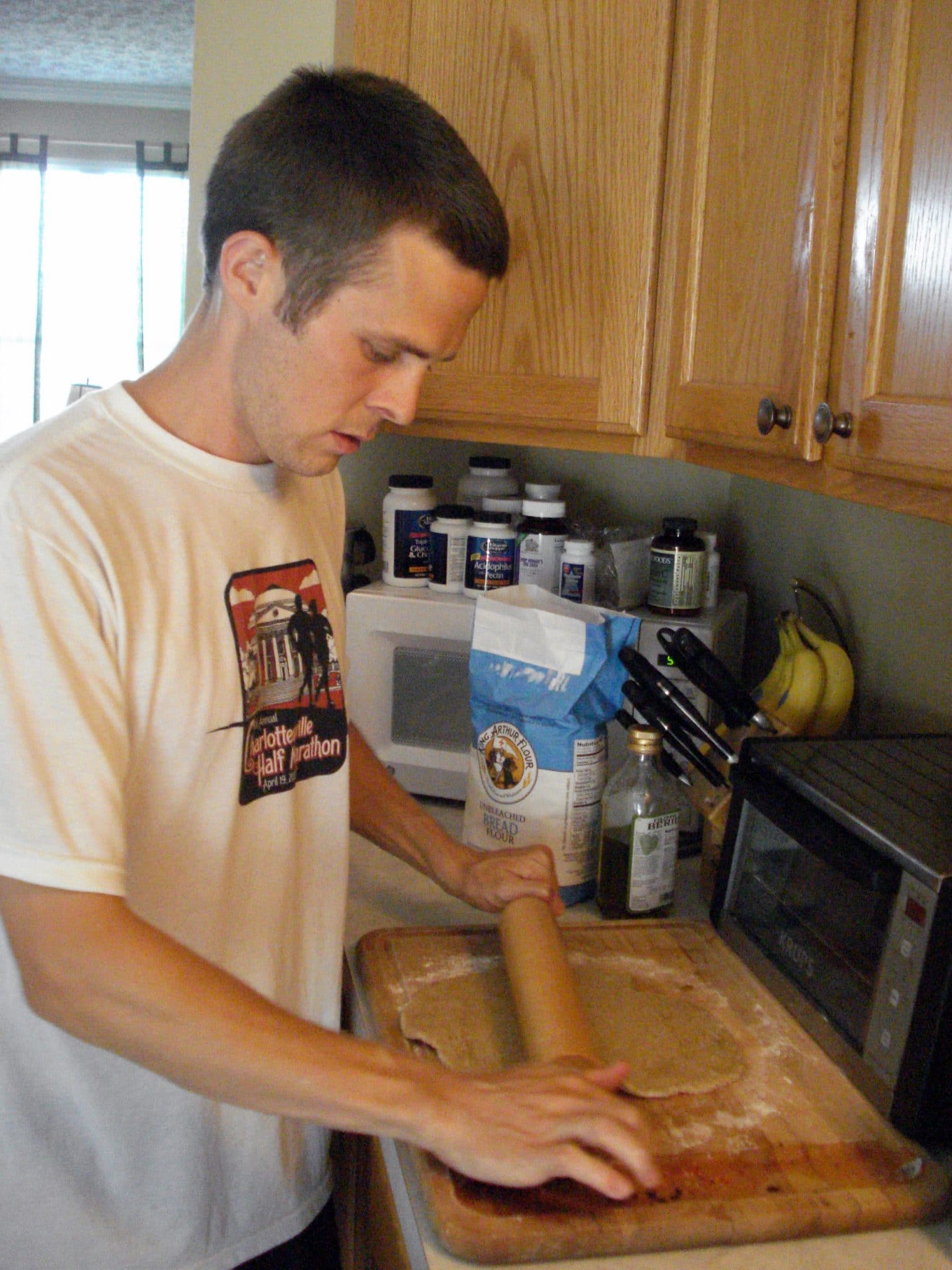 Matt rolling out pizza dough