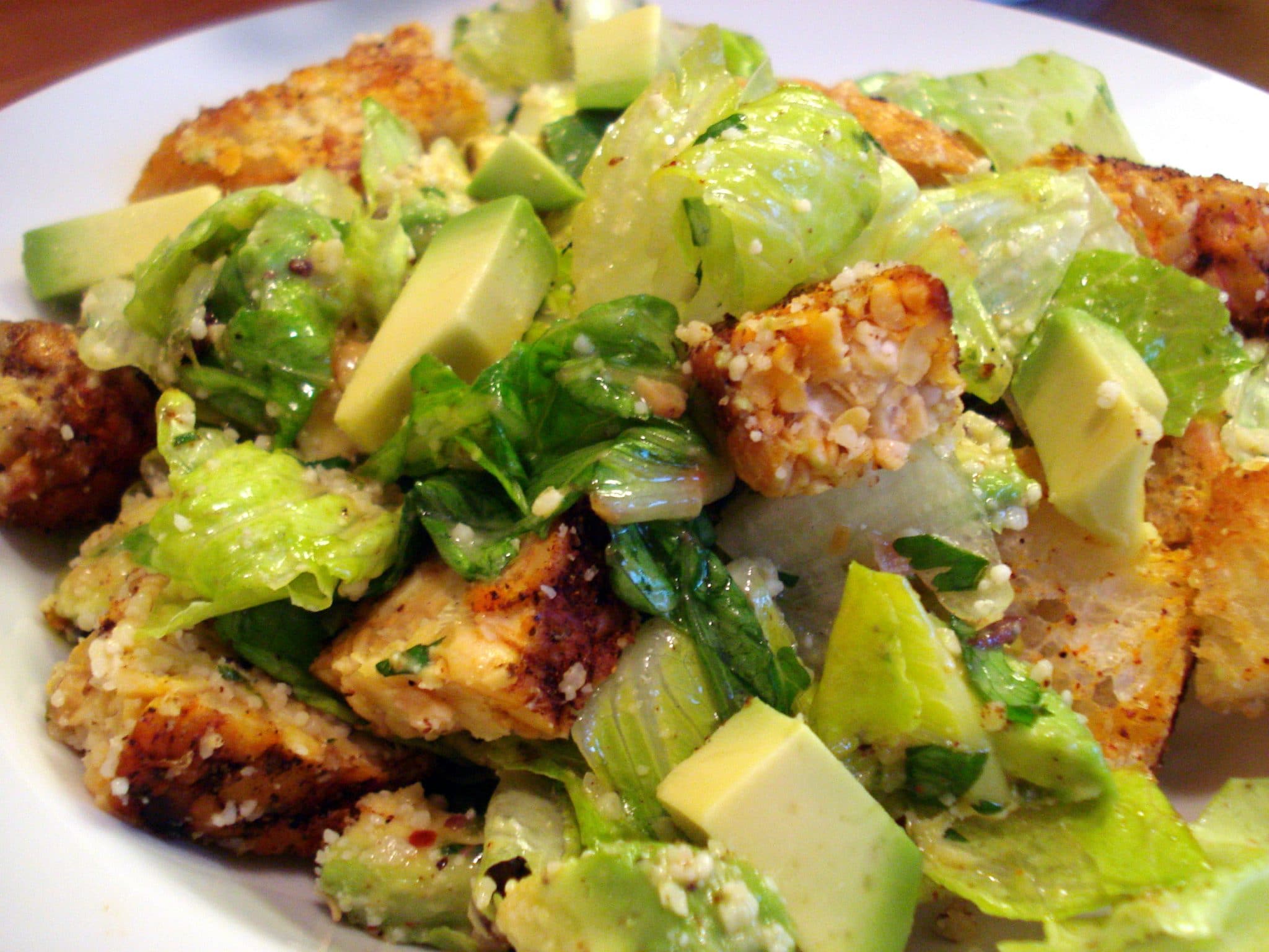 Close up of vegan Southwest Caesar Salad with Grilled Tempeh