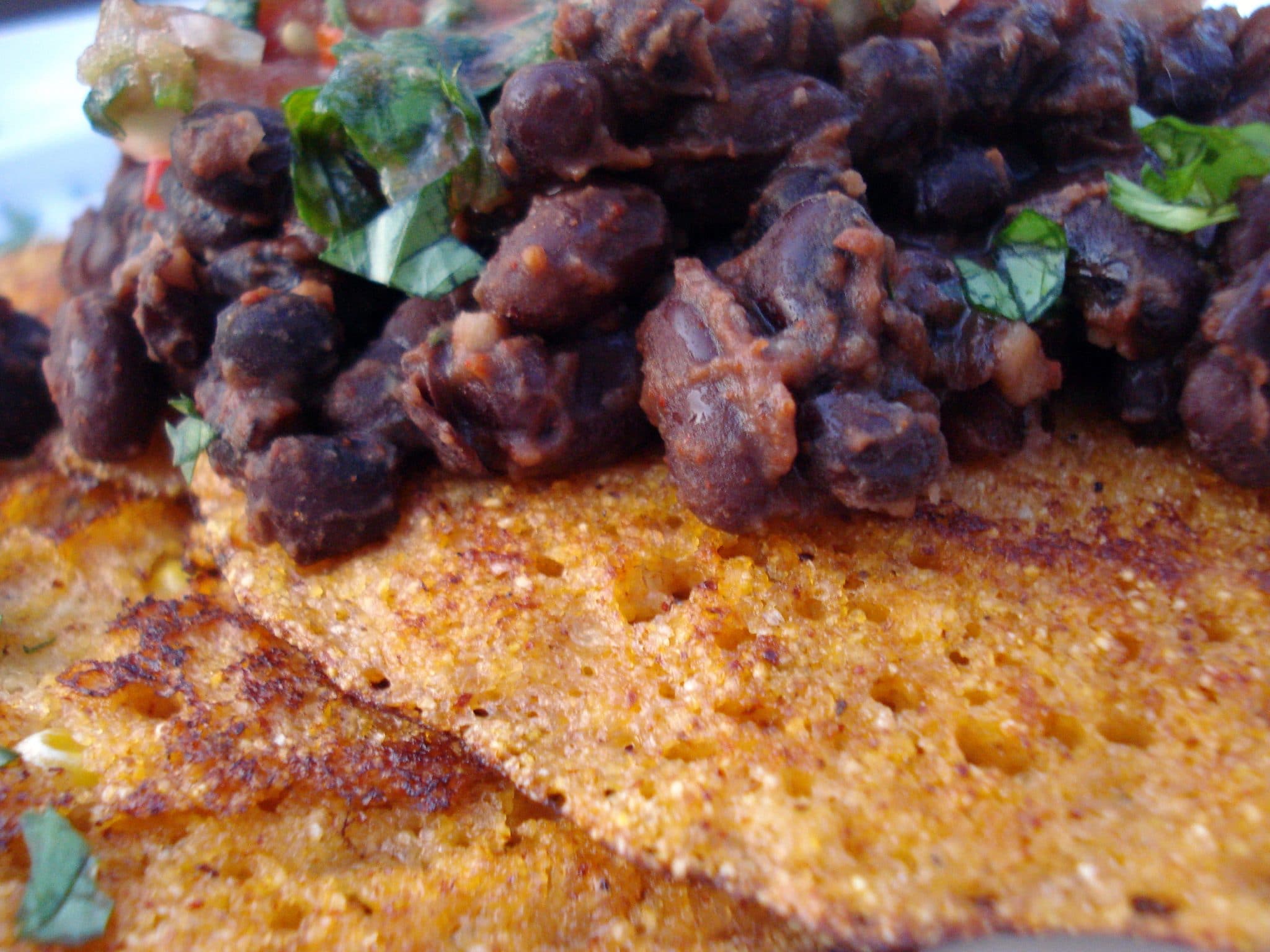 Close up of corn cakes with black beans