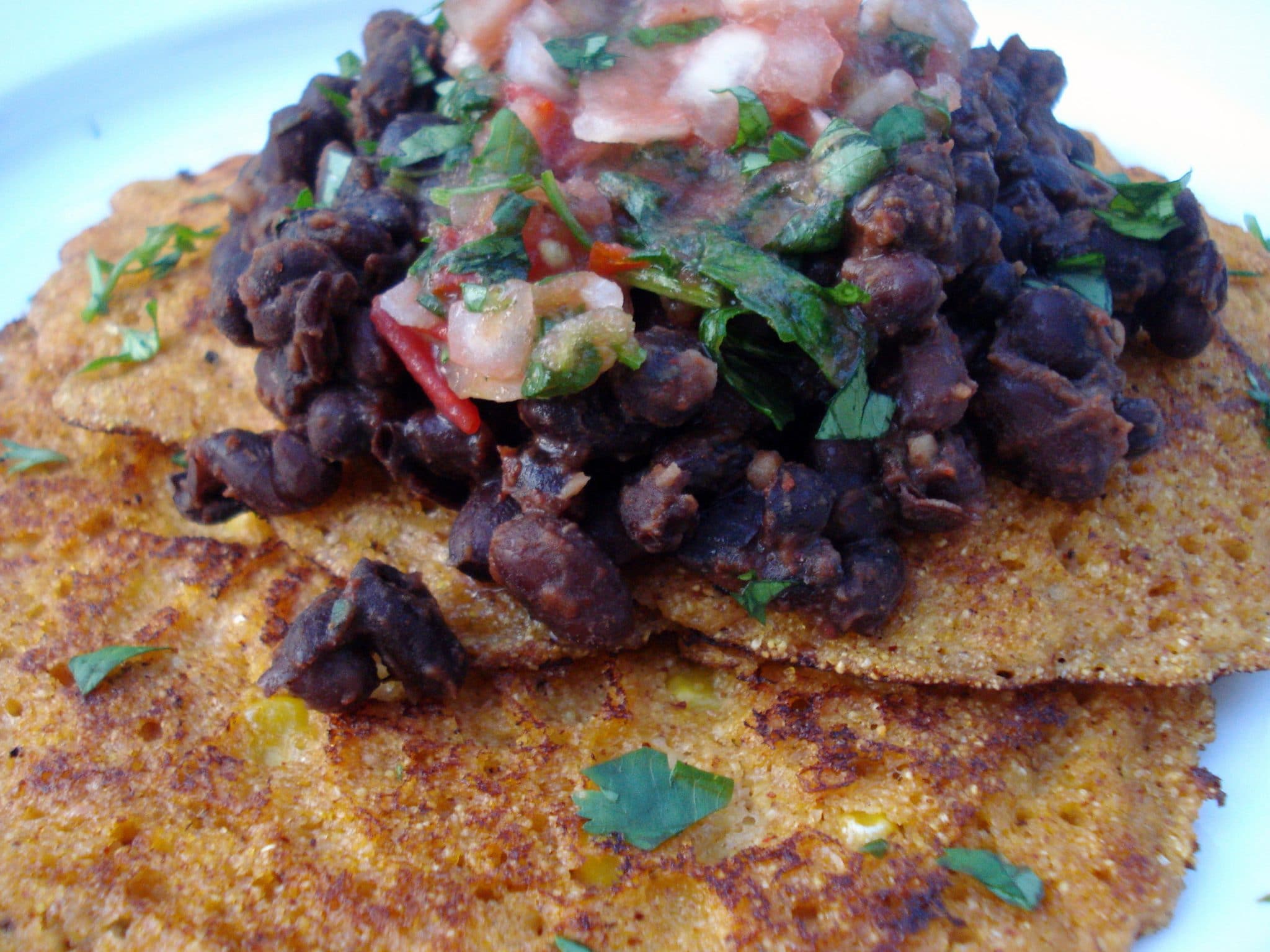 Corn cakes topped with black beans