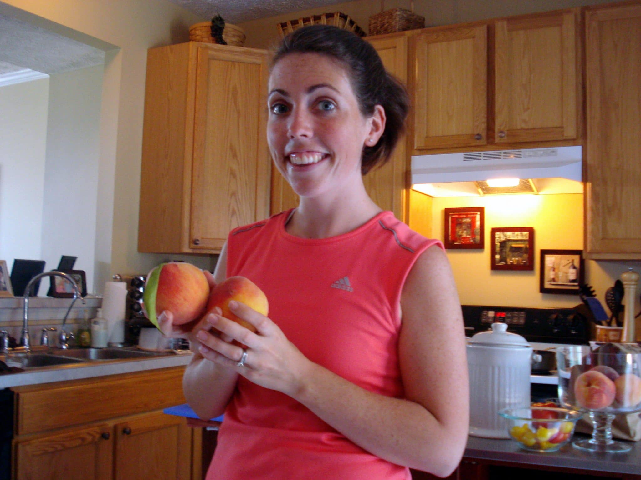 Woman holding fresh peaches