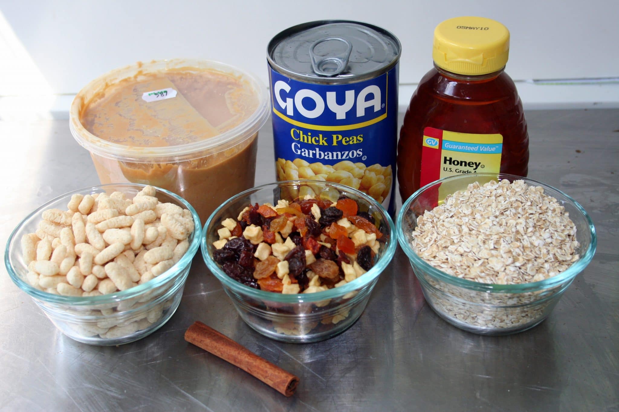 Ingredients to prepare Chickpea Granola Bars: beans, trail mix, oats, beans, peanut butter, and honey