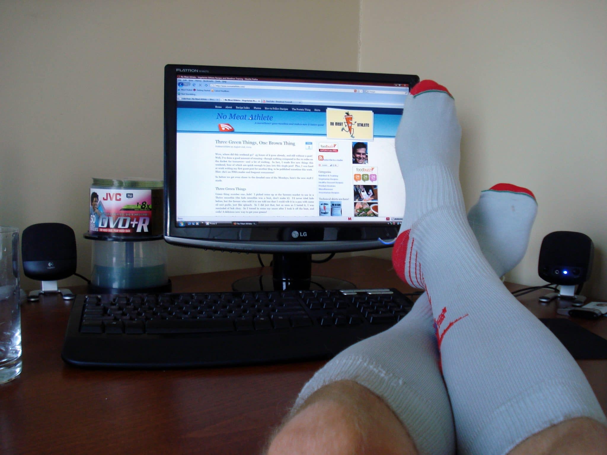 Matt wearing The Recovery Socks while propping feet up on desk in front of computer