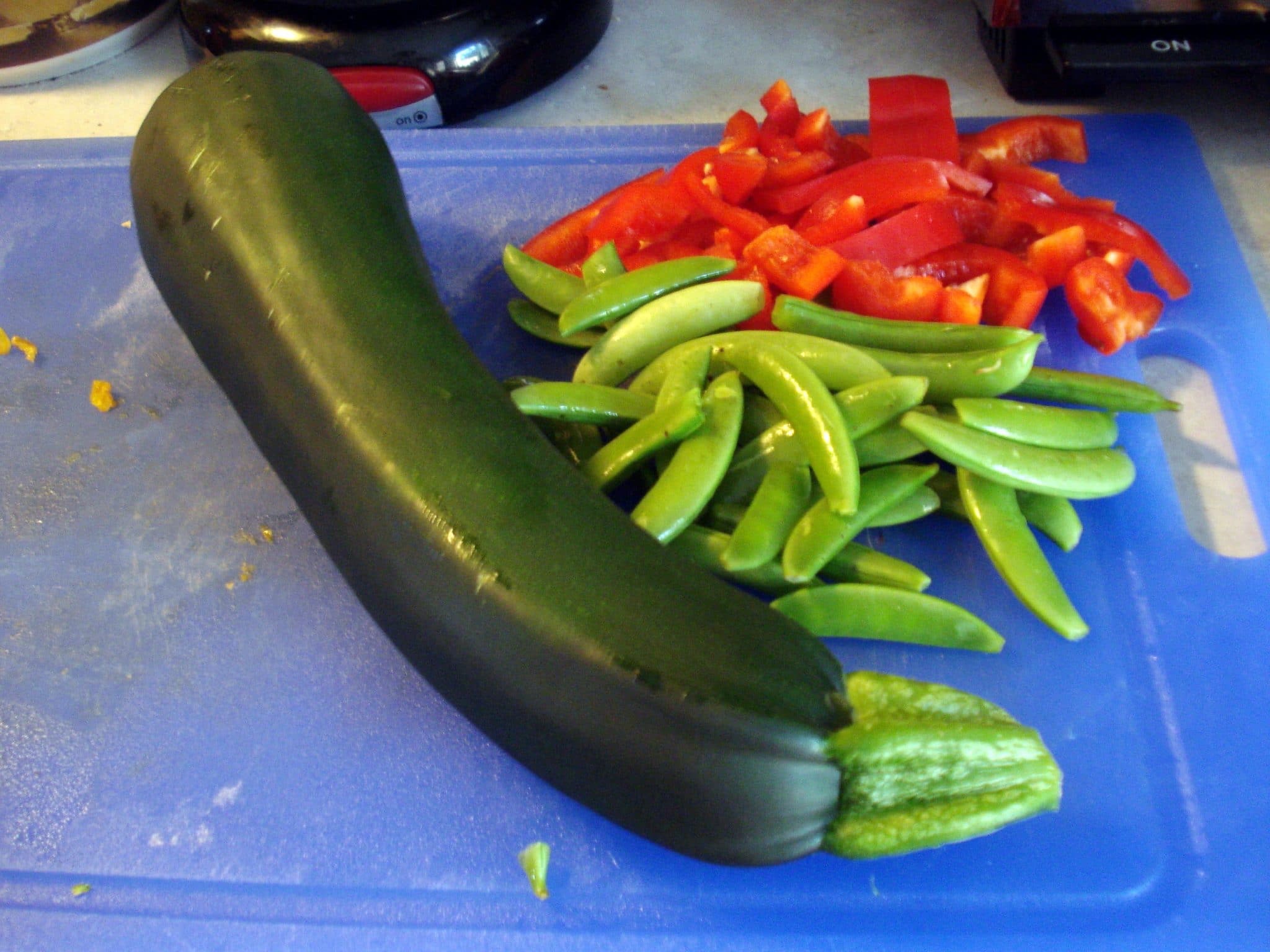 Zucchini on cutting board prepared to be chopped