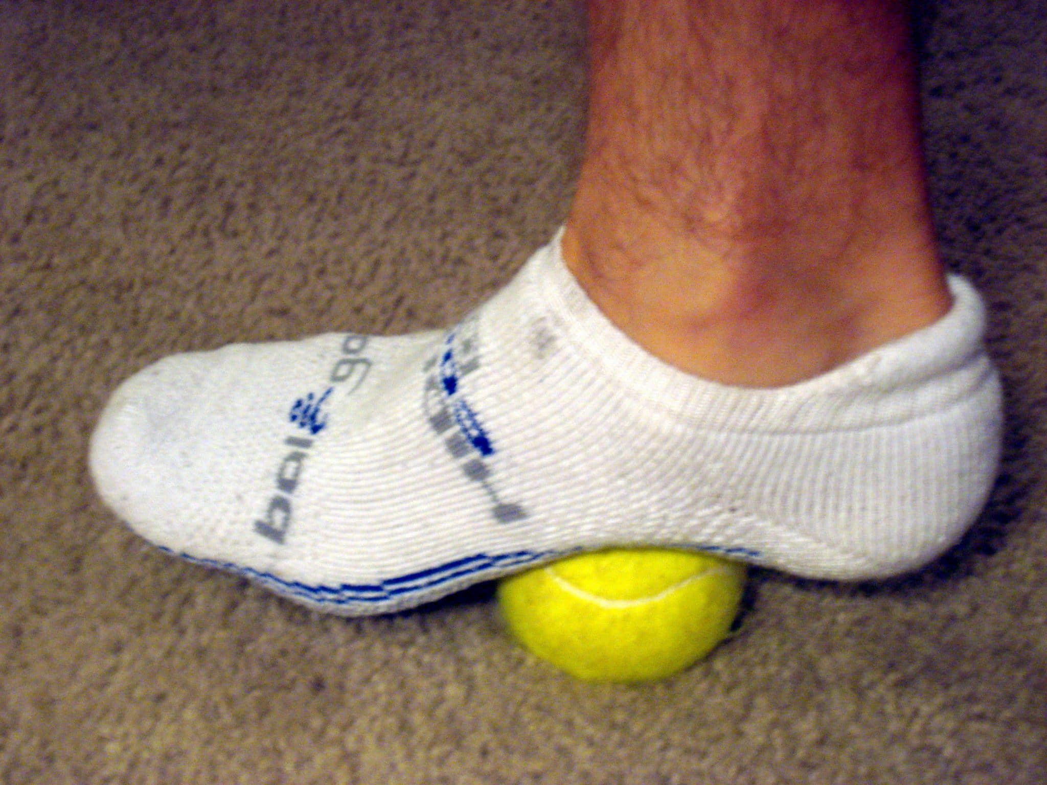 Tennis ball of roll out arch of foot