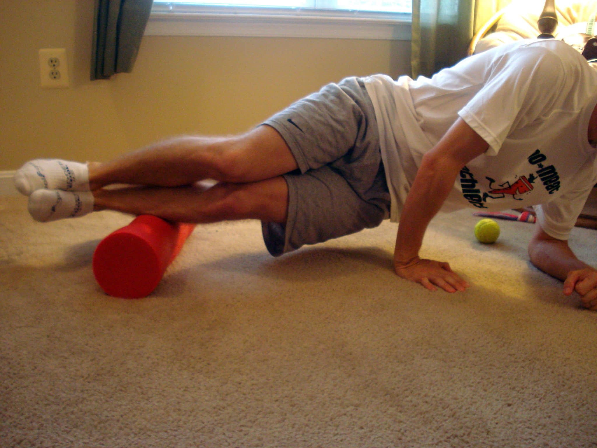 Foam rolling side of shins