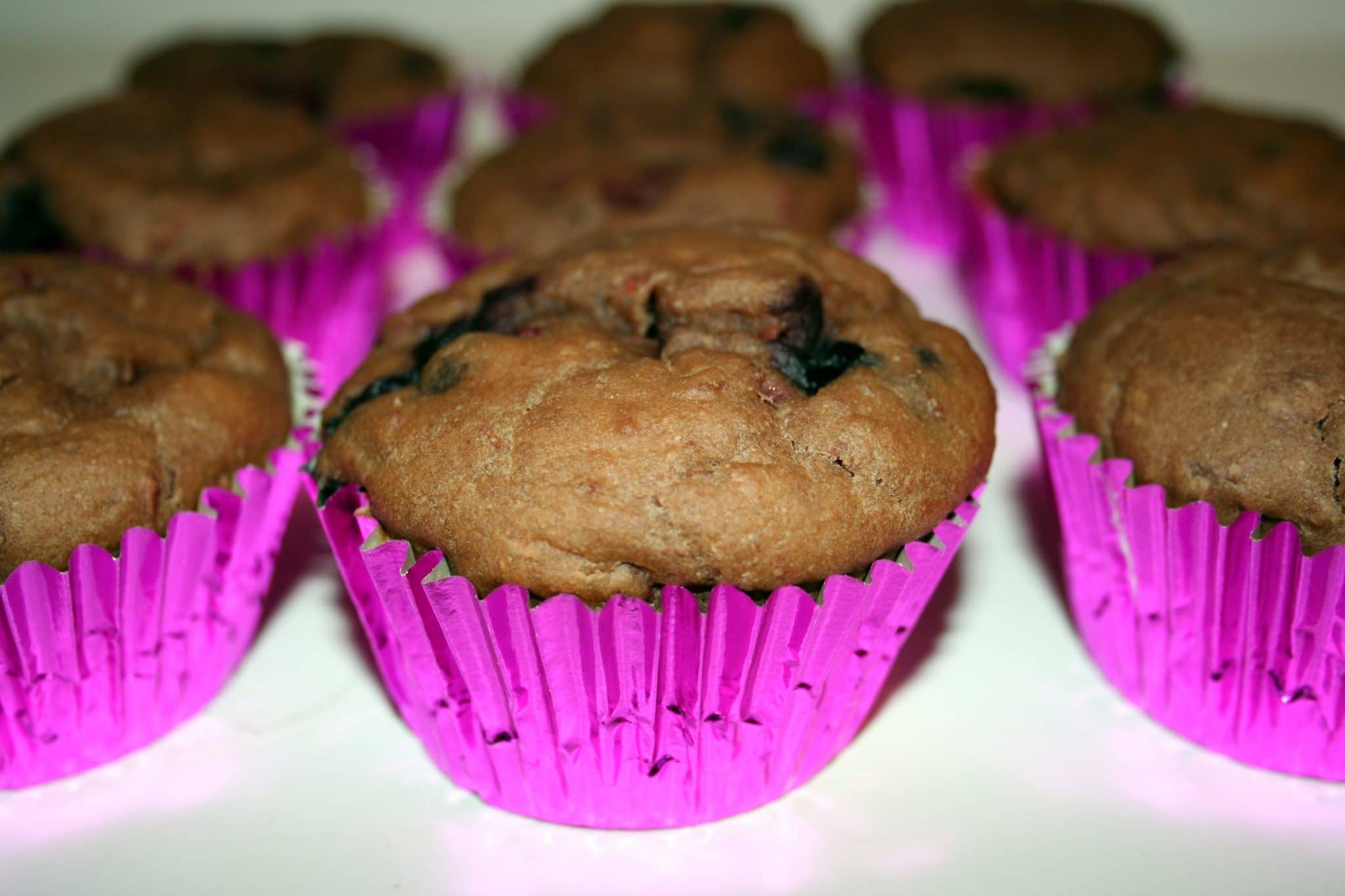 Vegan Pink Bean & Berry Muffins on table