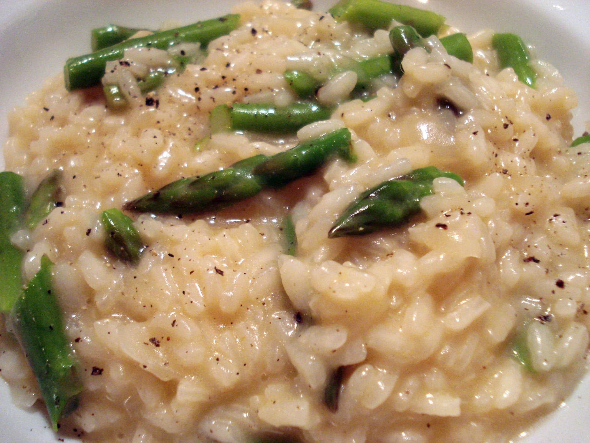 Close up of champagne risotto with asparagus