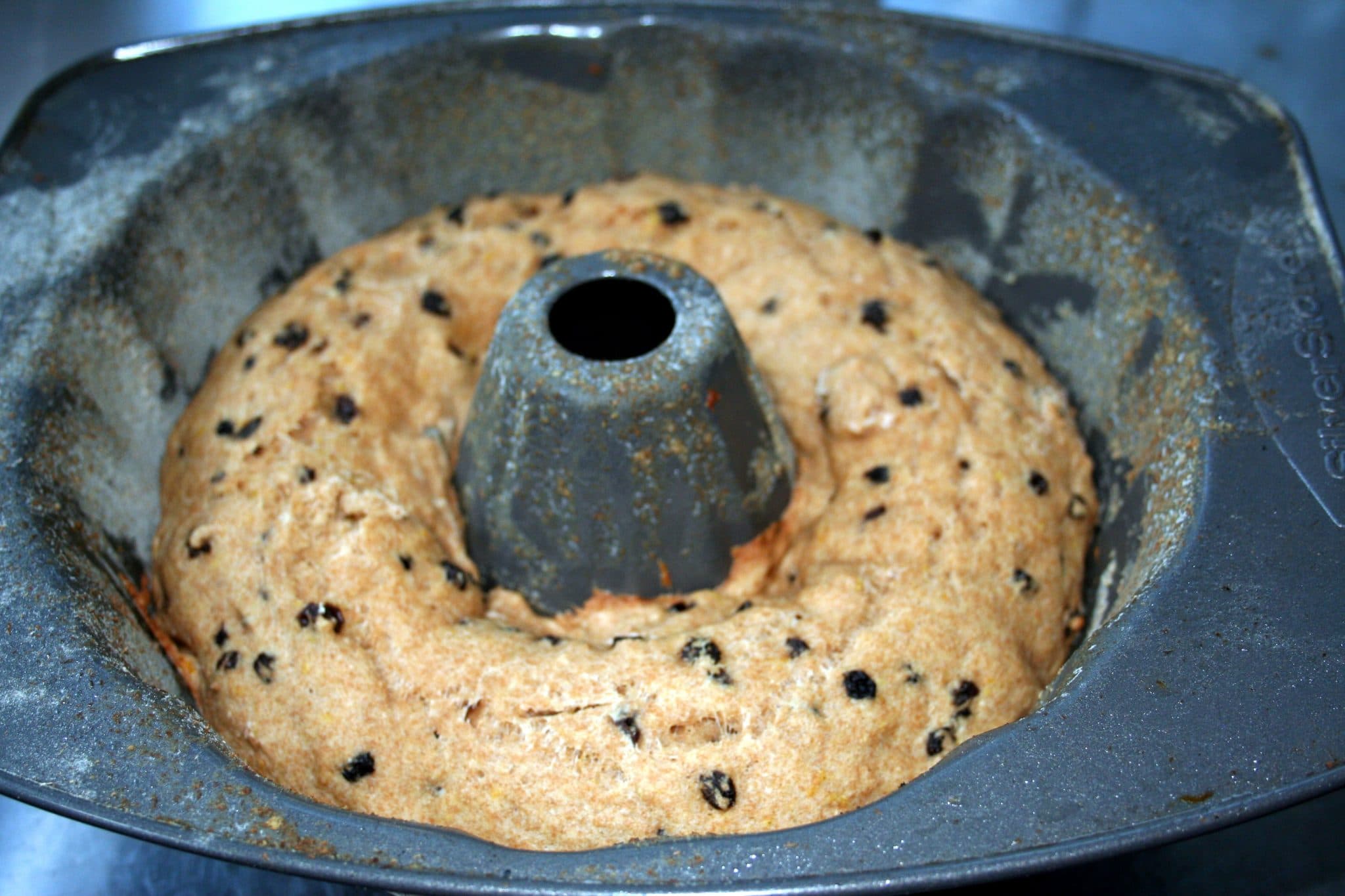 Raw Vegan Orange-Currant Brunch Cake in bundt pan to be cooked