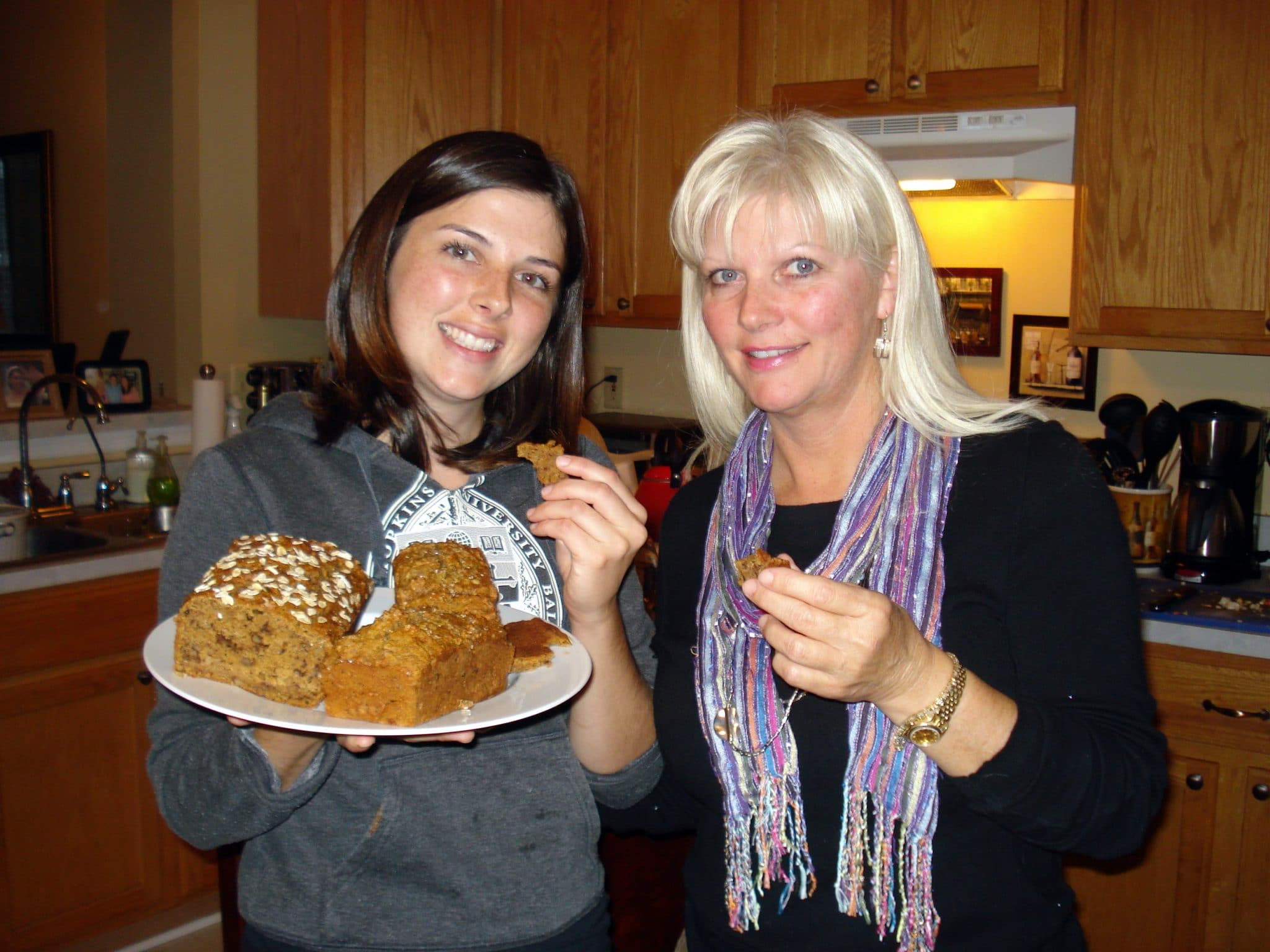 Christine enjoying piece of vegan pumpkin bread