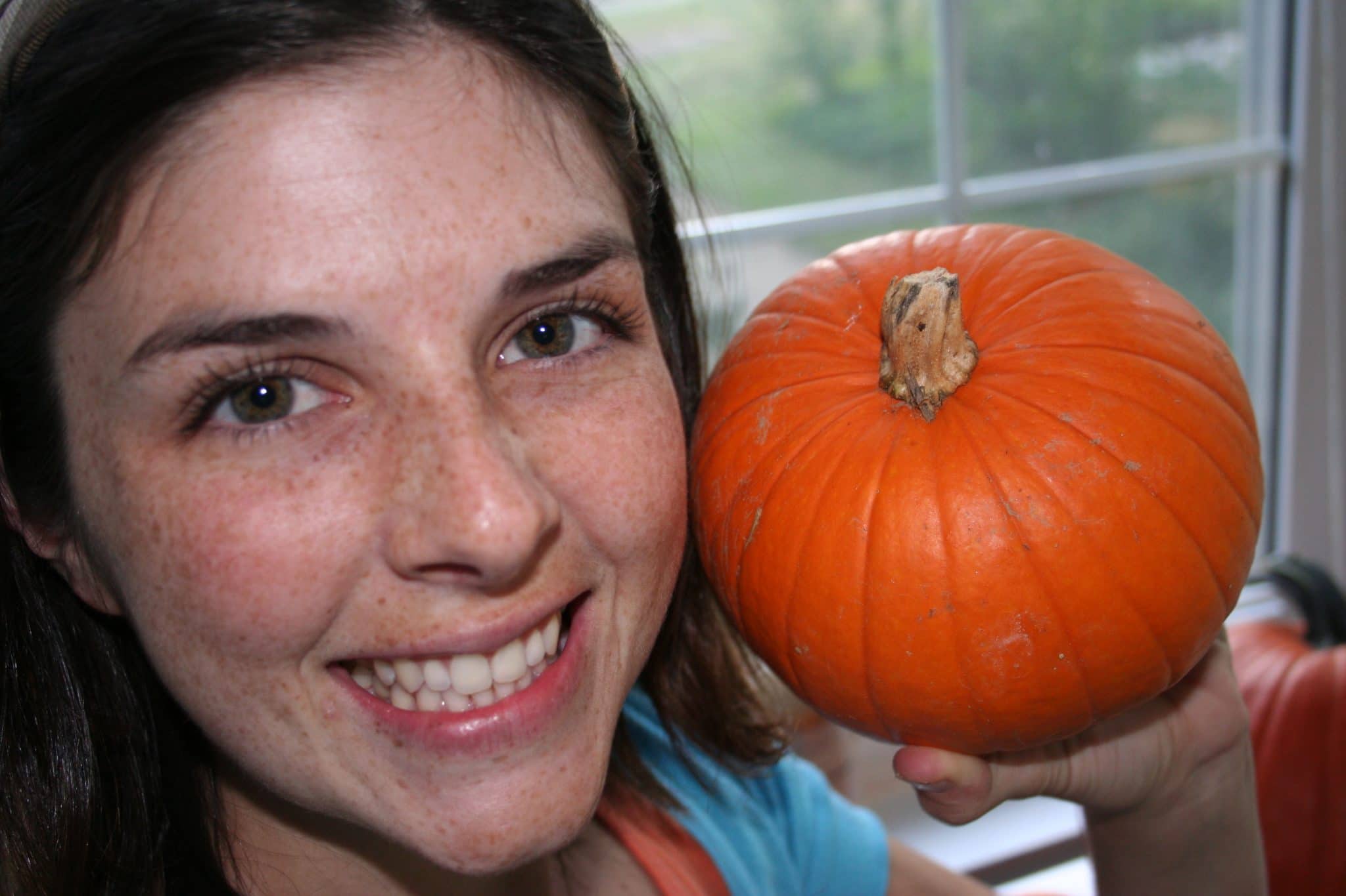 Woman with small pumpkin
