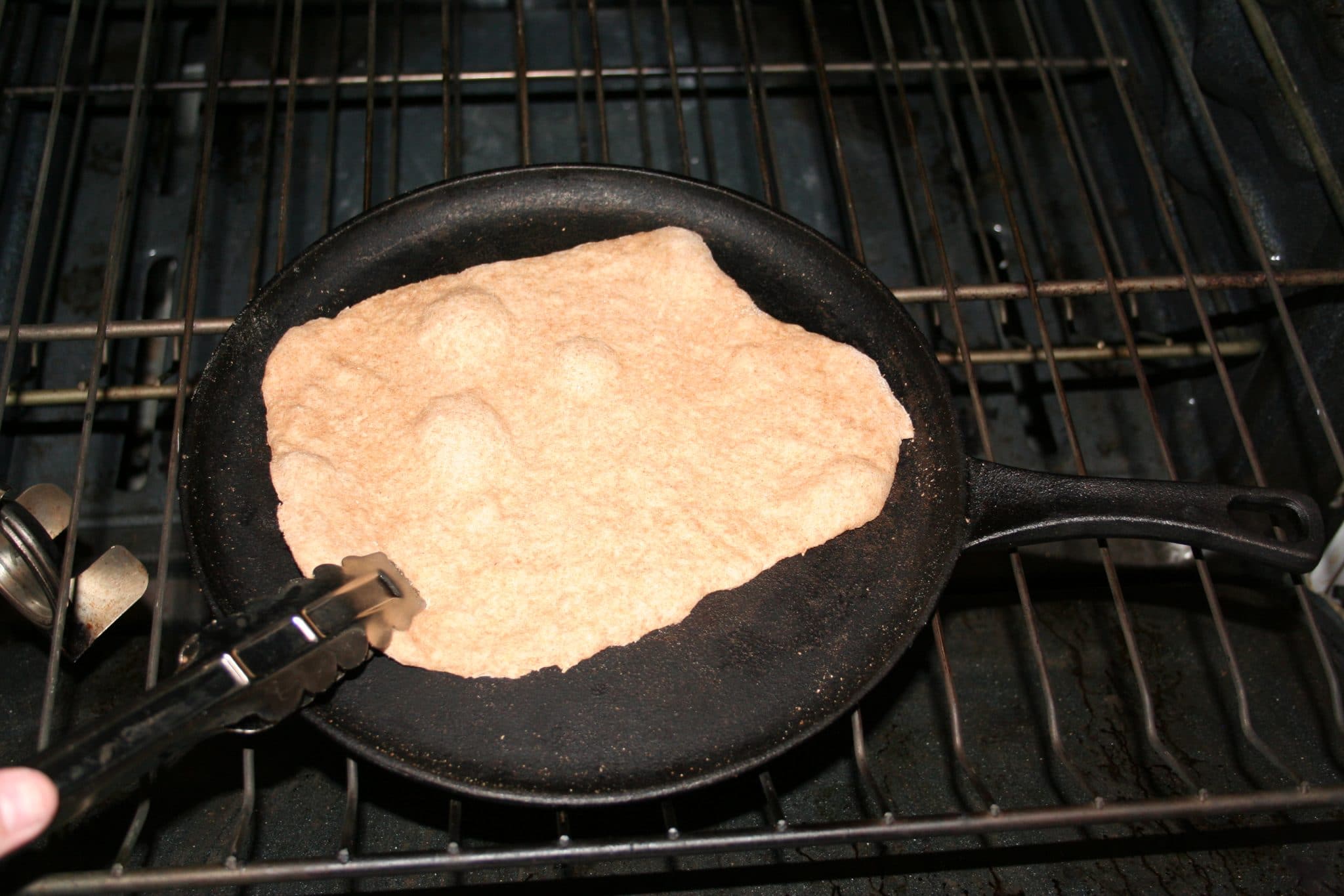 One vegan flatbread cooked in cast iron skillet