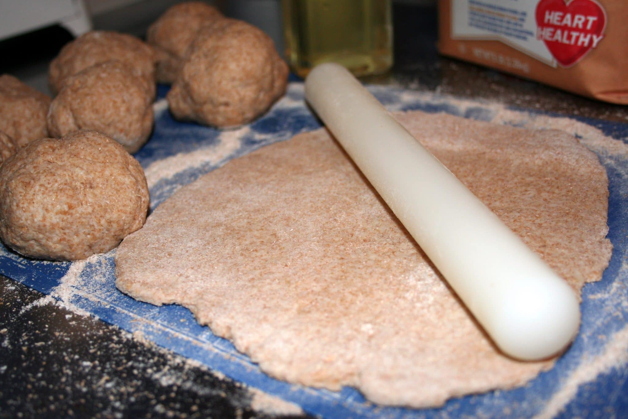 Image of vegan flatbread being rolled out flat