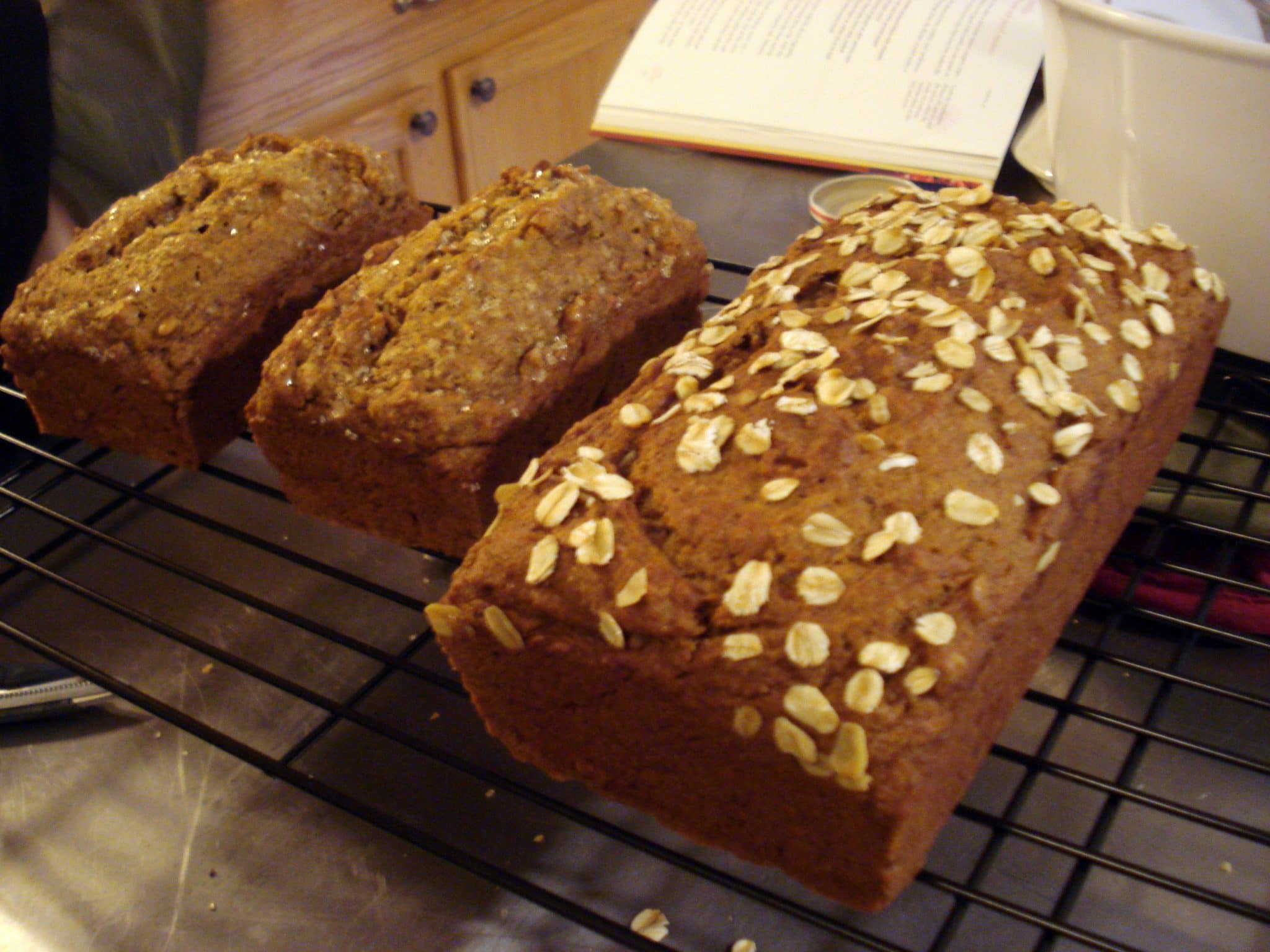 3 vegan pumpkin breads on a cooling rack