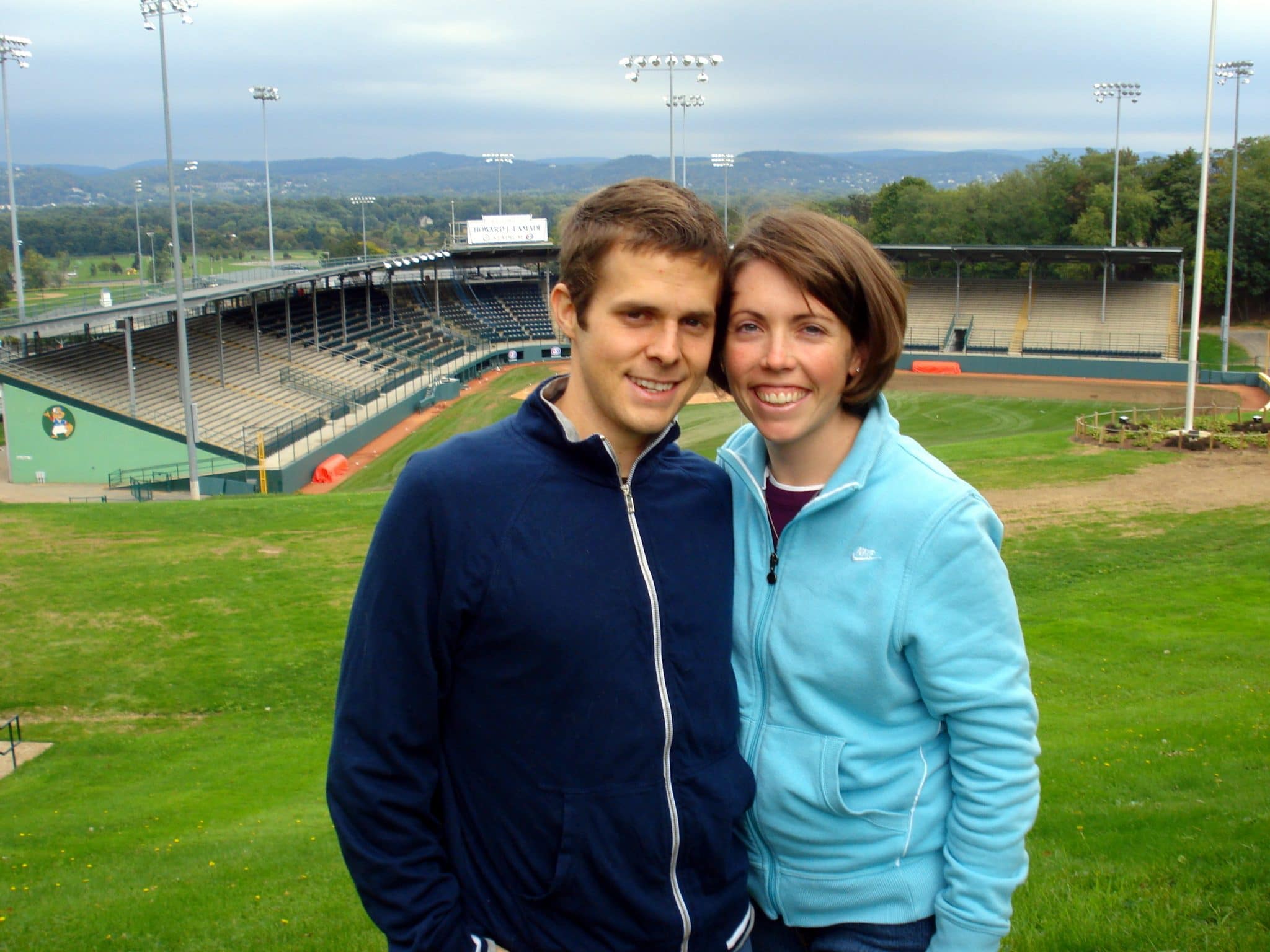 Matt and wife Erin posing in front of baseball stadium