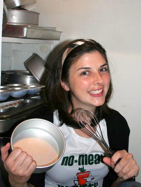 Woman holding bowl and whisk