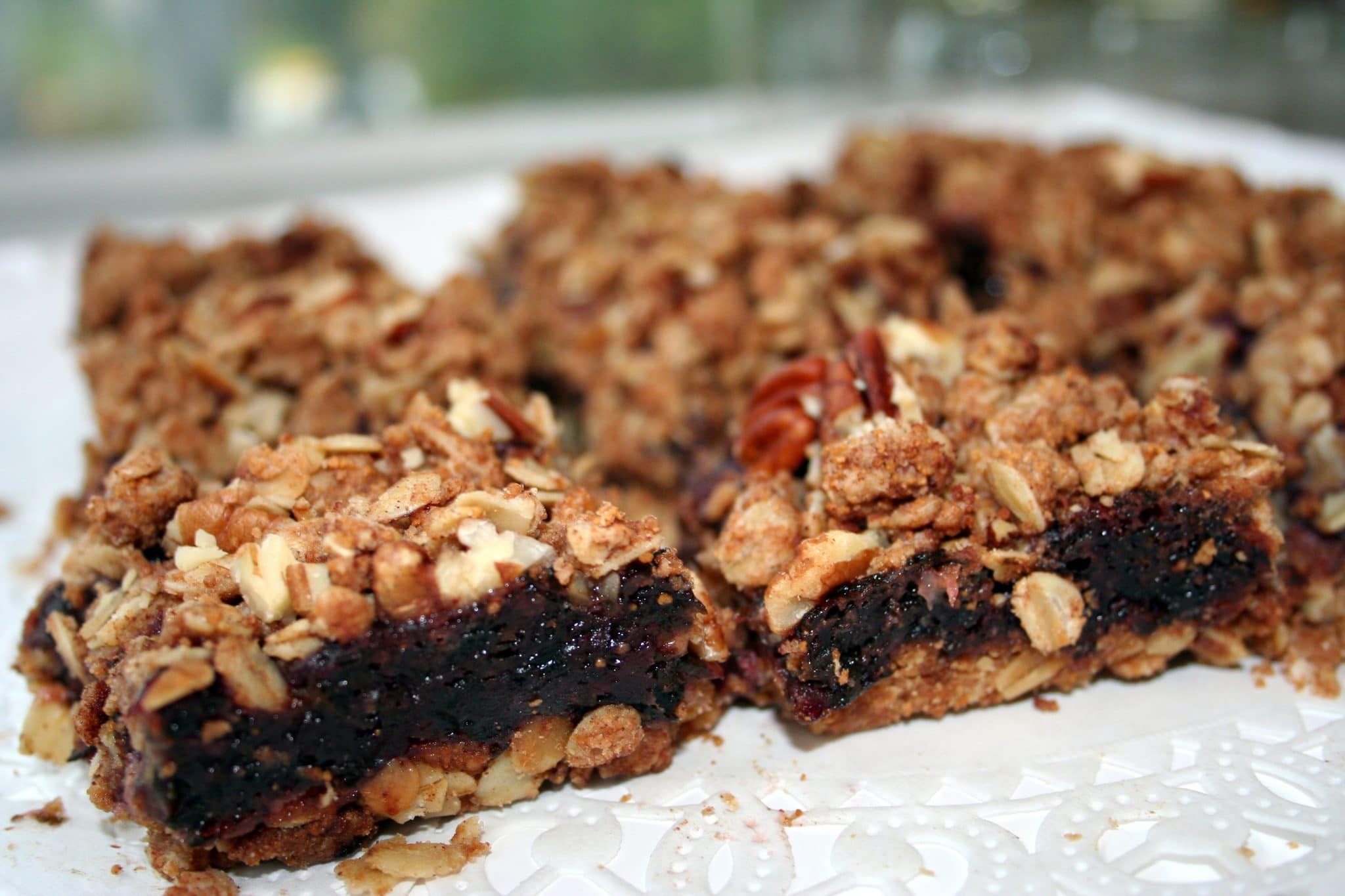 Close up on Vegan Cranberry Spinach Bars cut in half to show filling