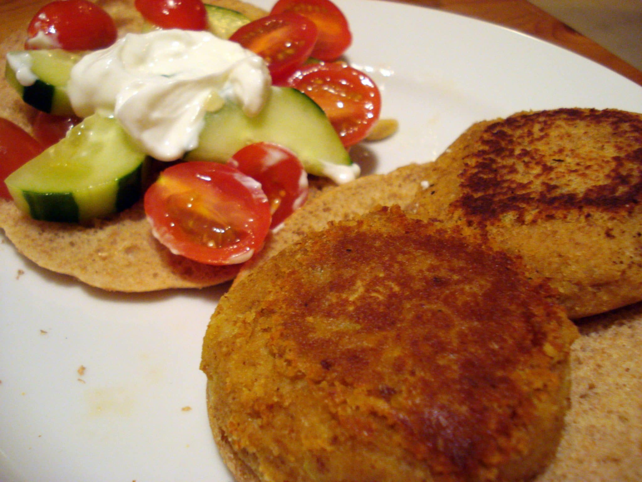 Homemade falafel on pita with mini-tomatoes and zucchini