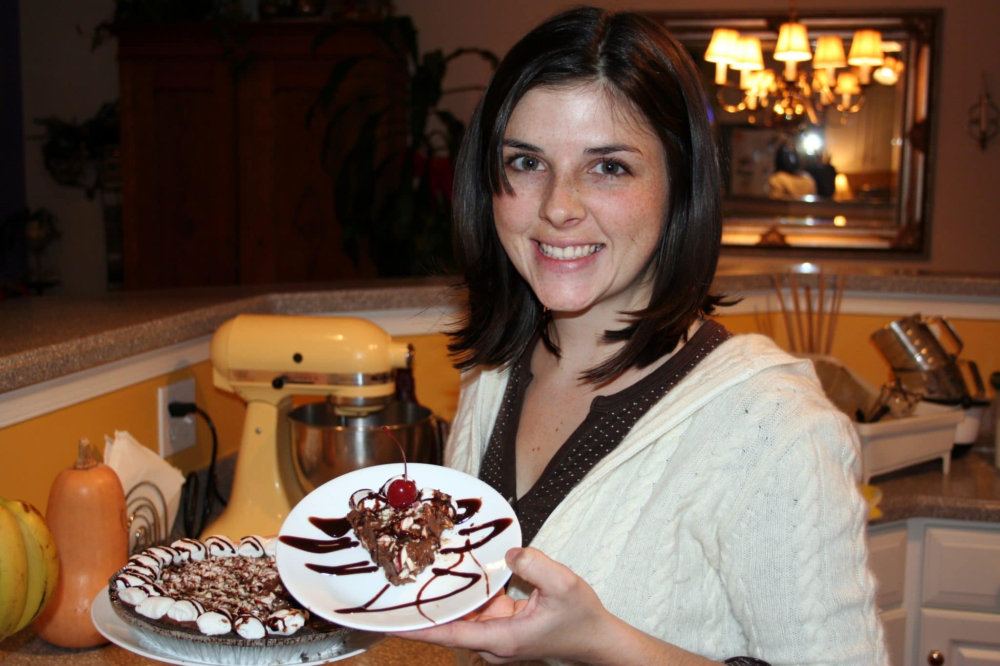 Woman holding slice of Vegan Chocolate Cream Pie