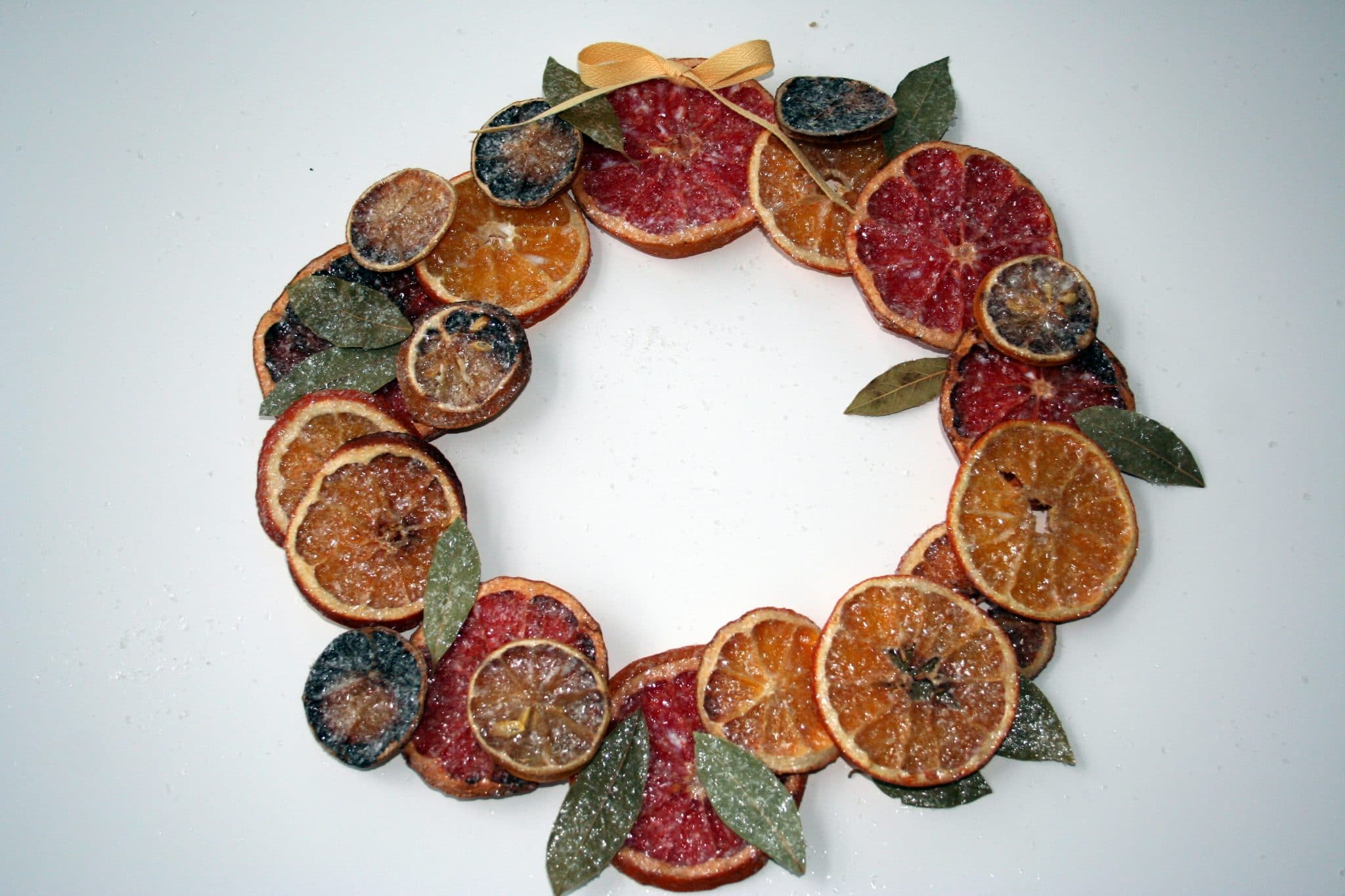 Baked Ornaments Christmas Wreath featuring oranges, blood oranges, and sage