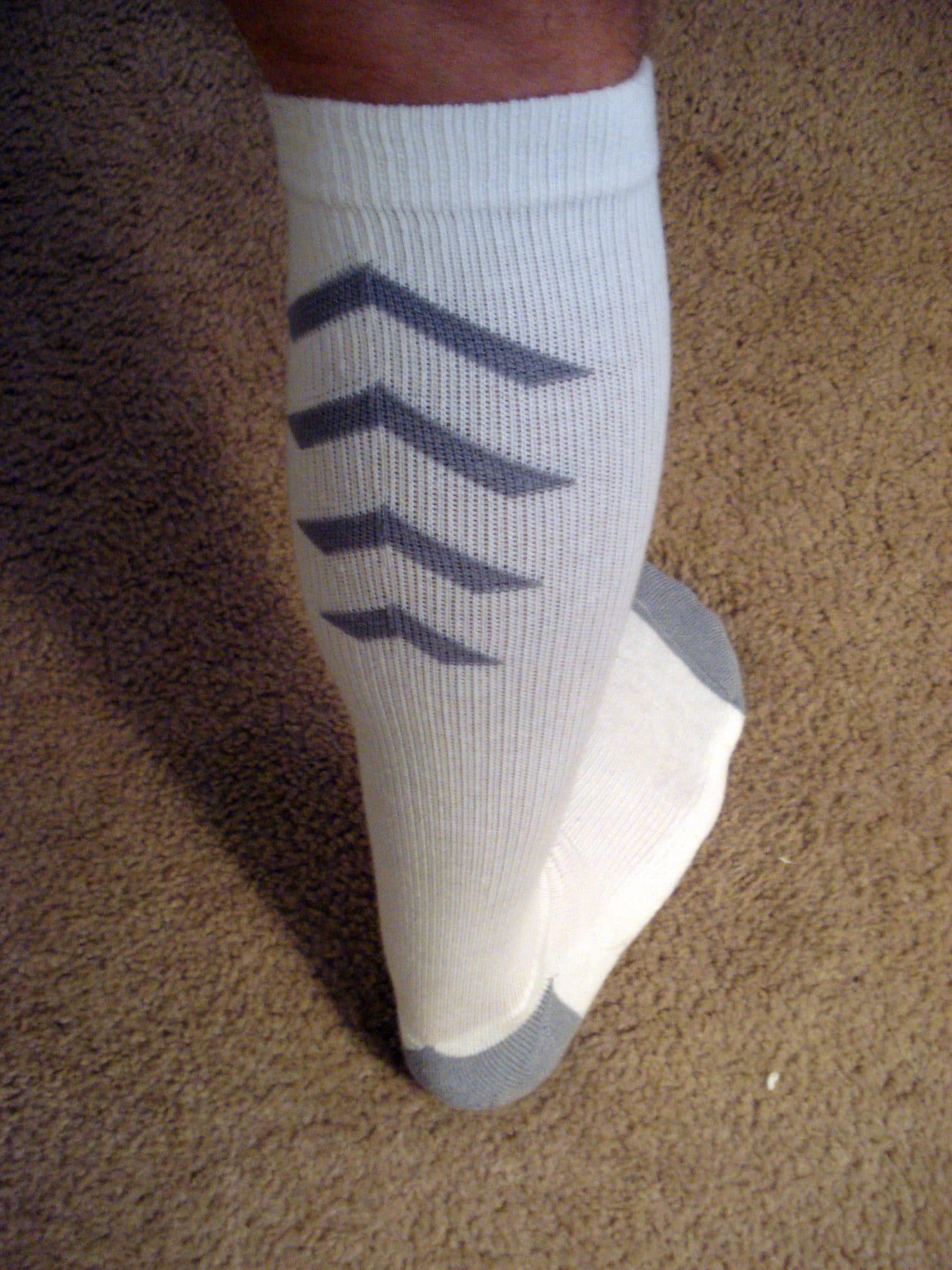 Matt wearing SIGVARIS compressions socks, photographed from behind.