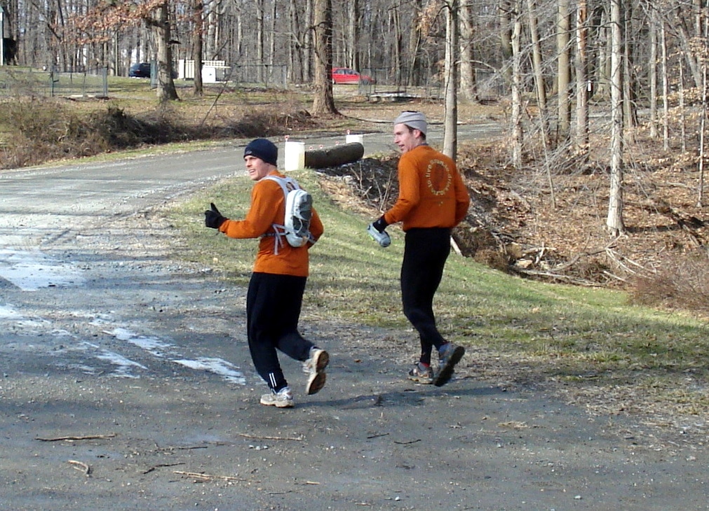 Matt and pacer running up a road