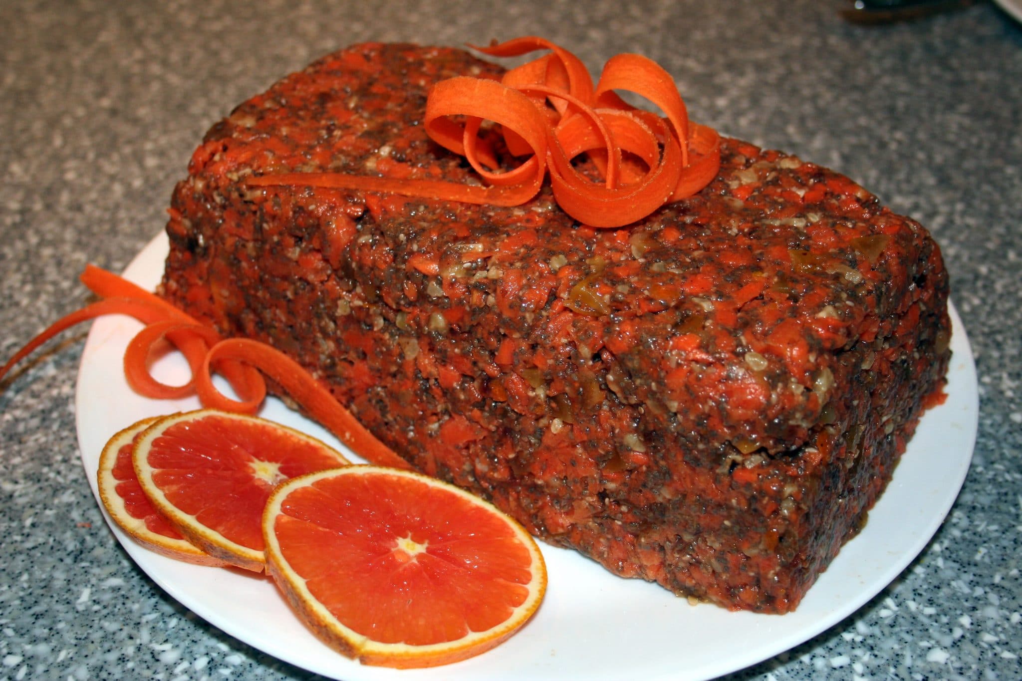 Vegan Raw Chia-Carrot Cake with carrot ribbons on top