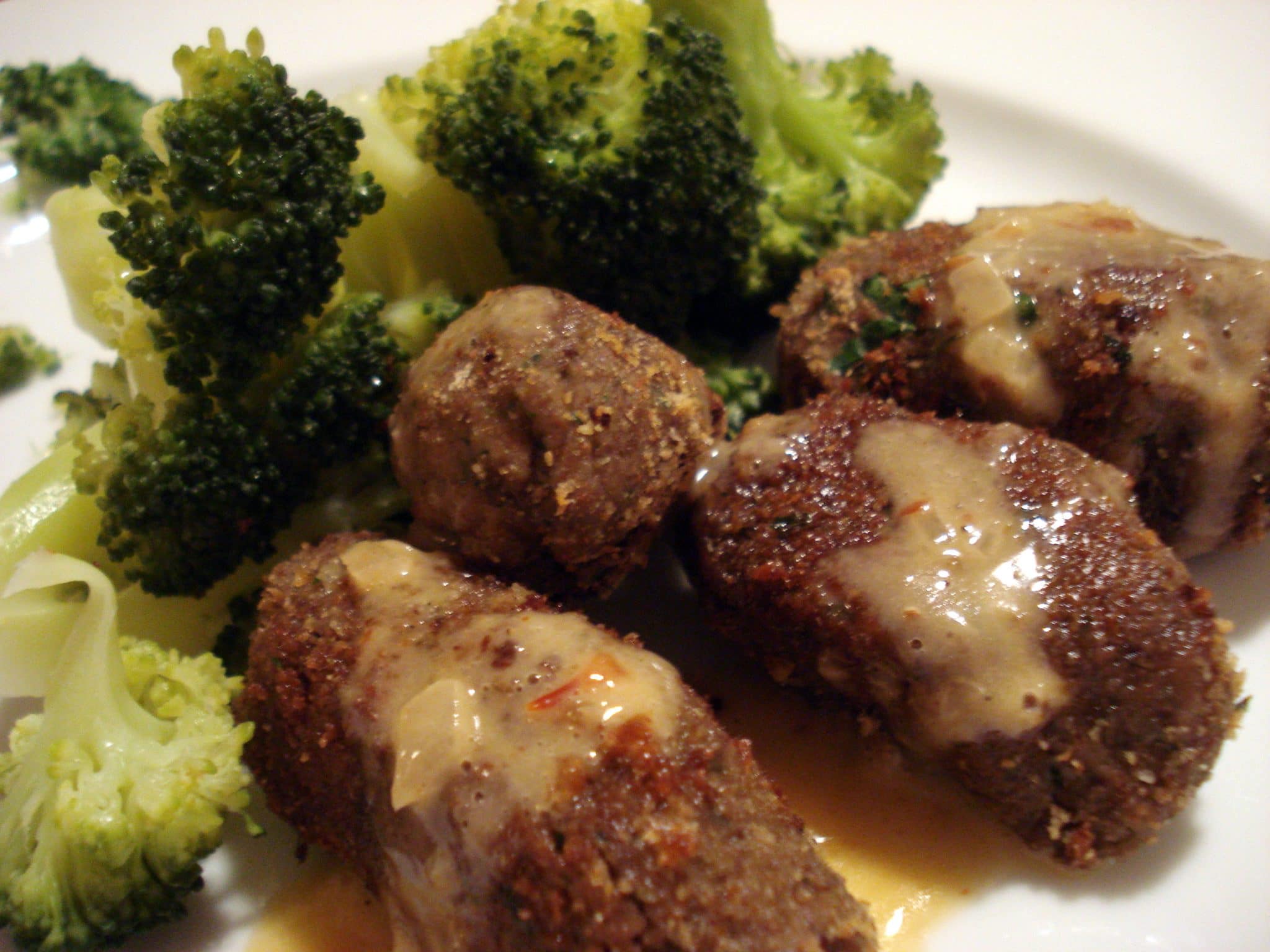 Plate of Black bean and walnut croquettes with a side of broccoli