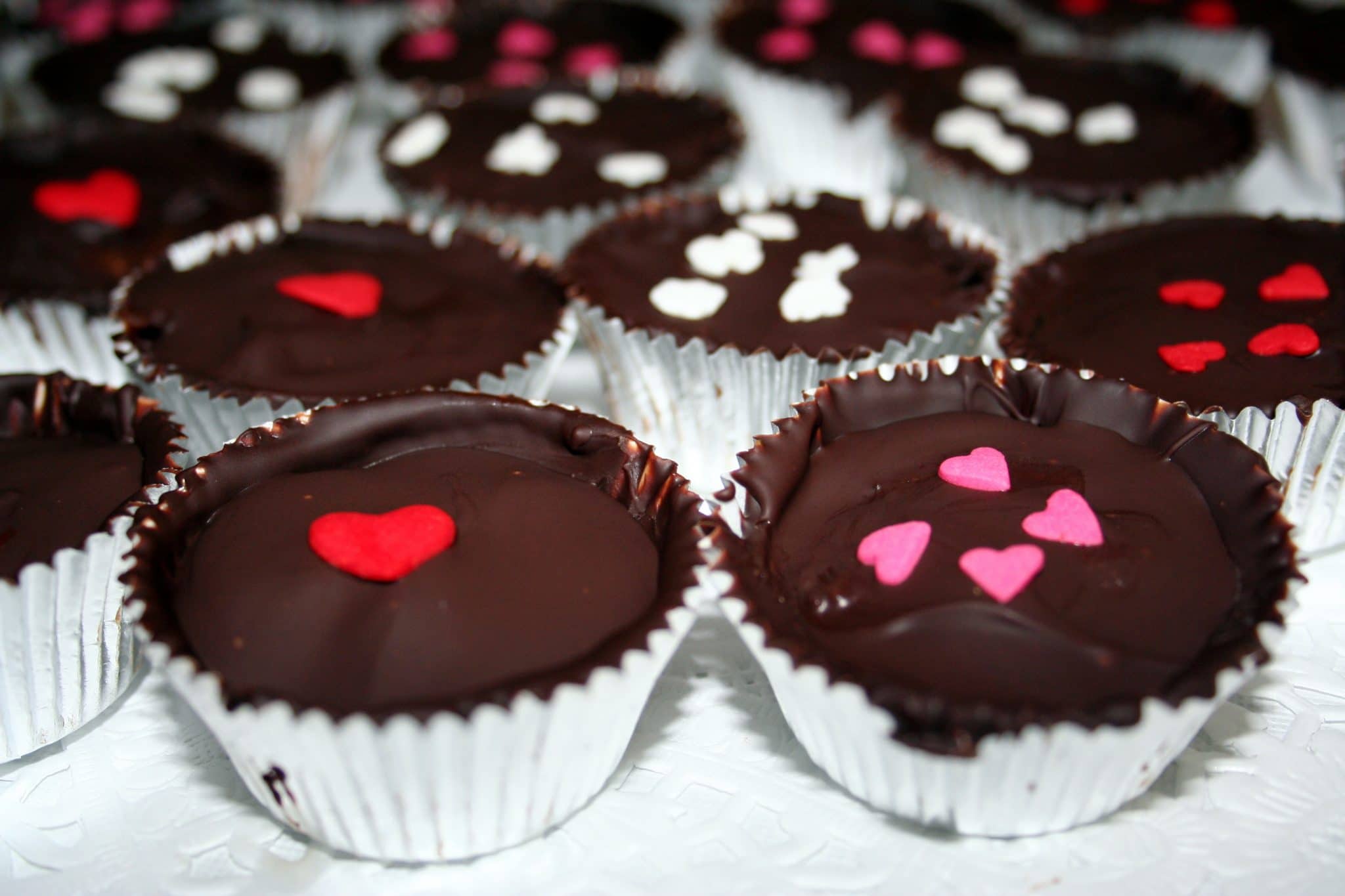 Homemade vegan chocolates with red hearts on top