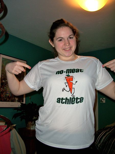 Woman excited to be wearing white throwback NMA shirt