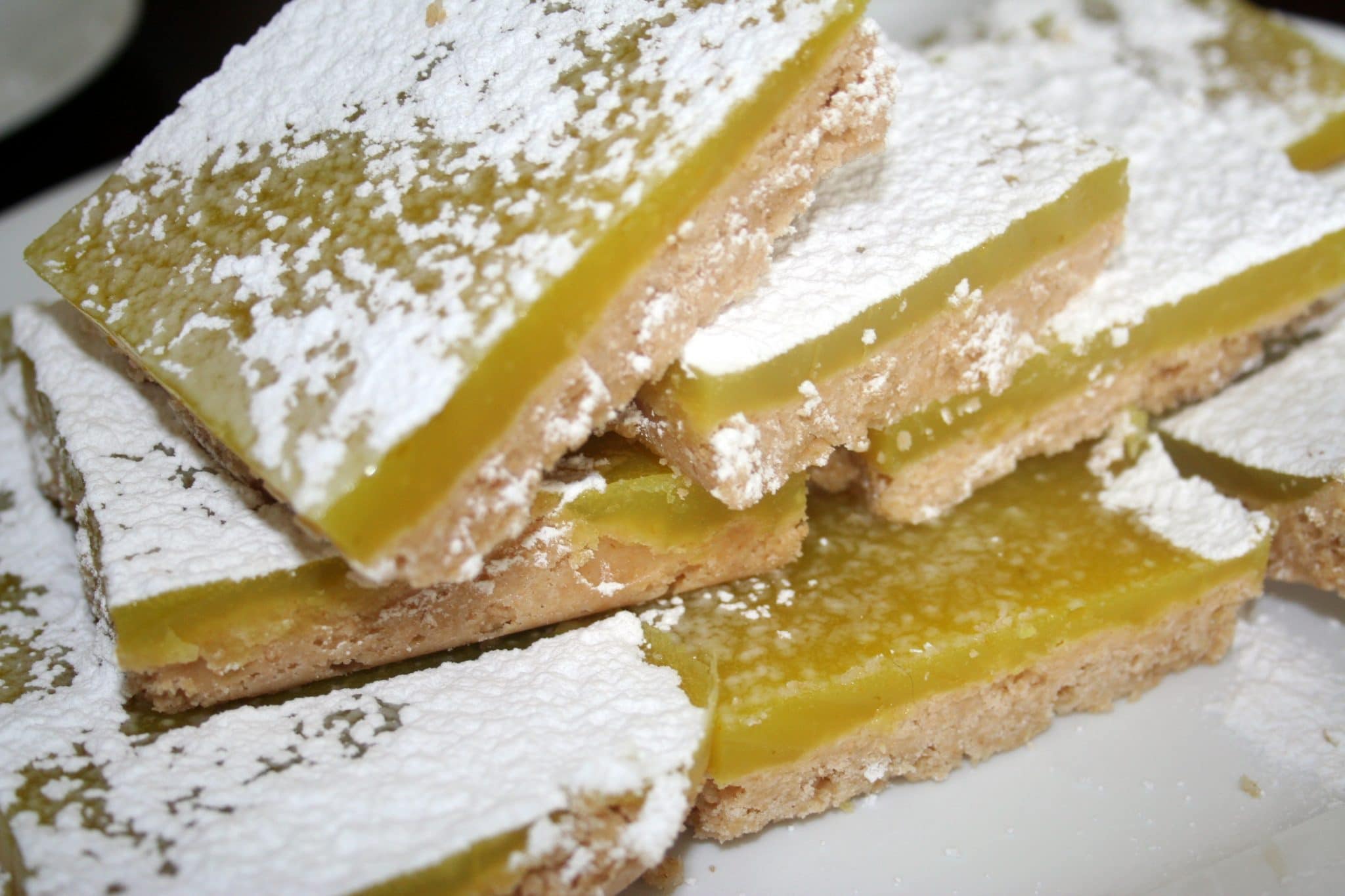 Close up with vegan lemon bars with powdered sugar on top