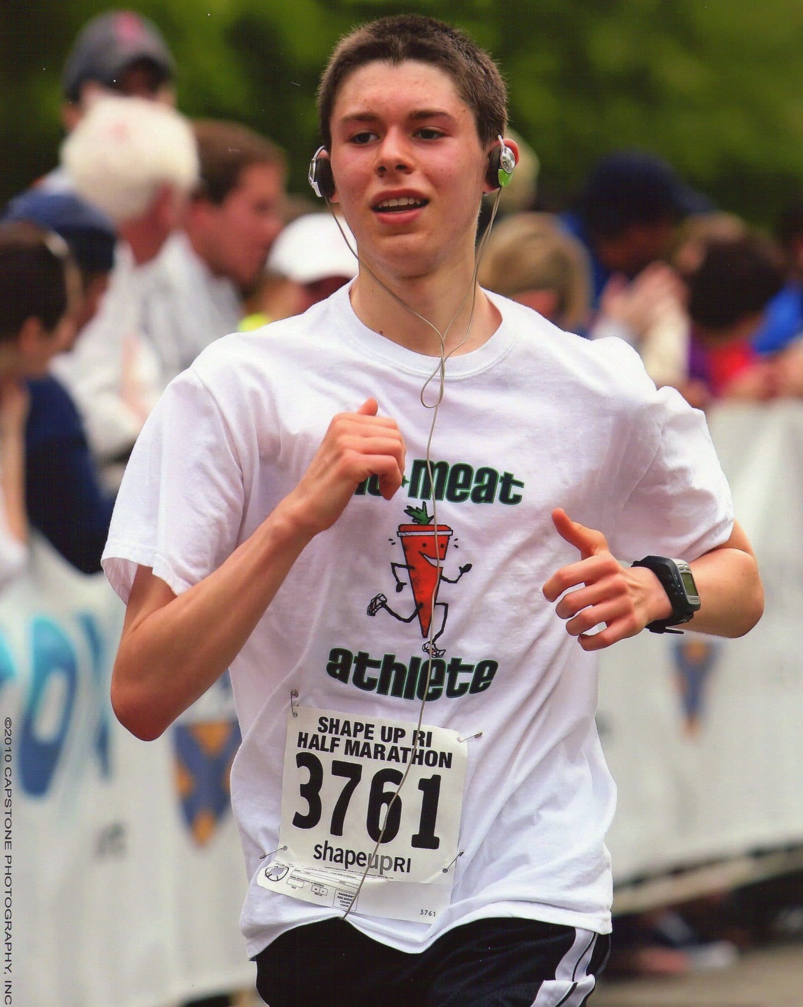 Young guy running in white throwback carrot shirt