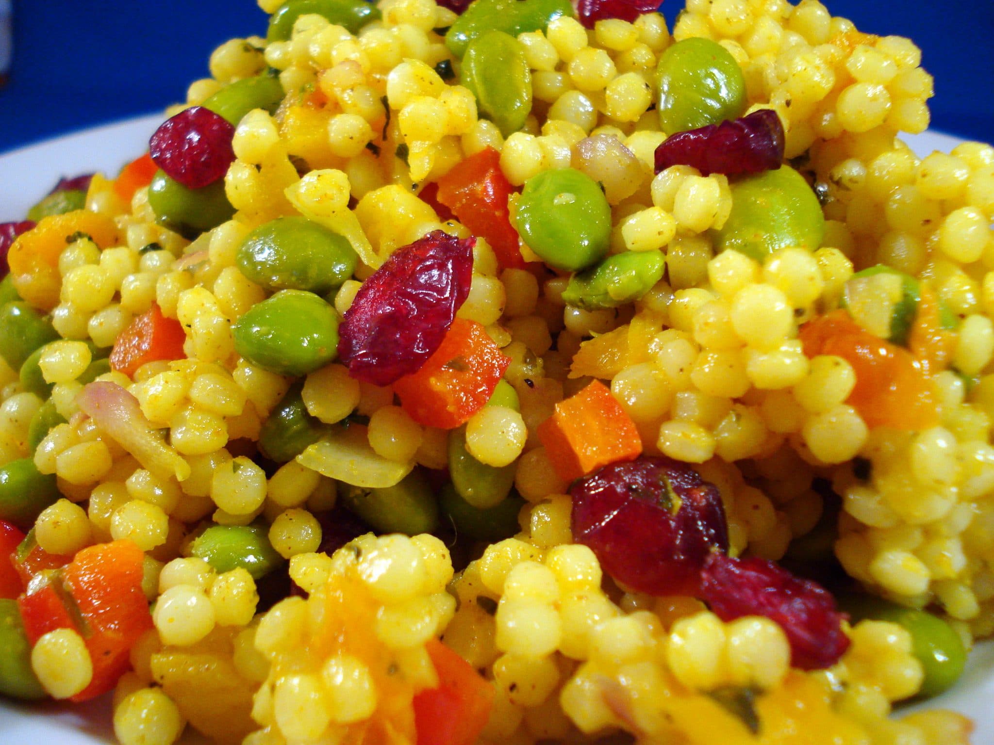 Vegan couscous salad with cranberries and peas