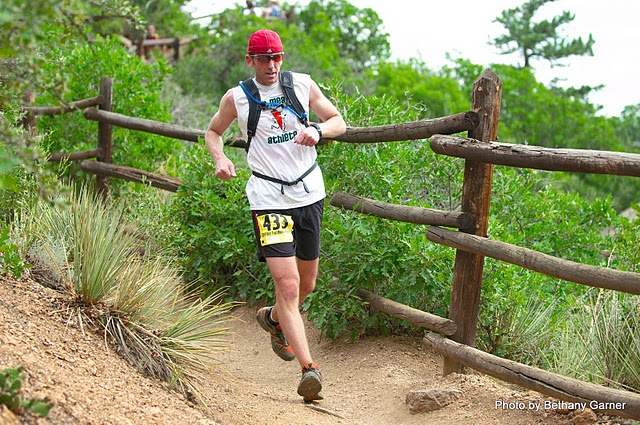 Man in throwback carrot shirt trail running