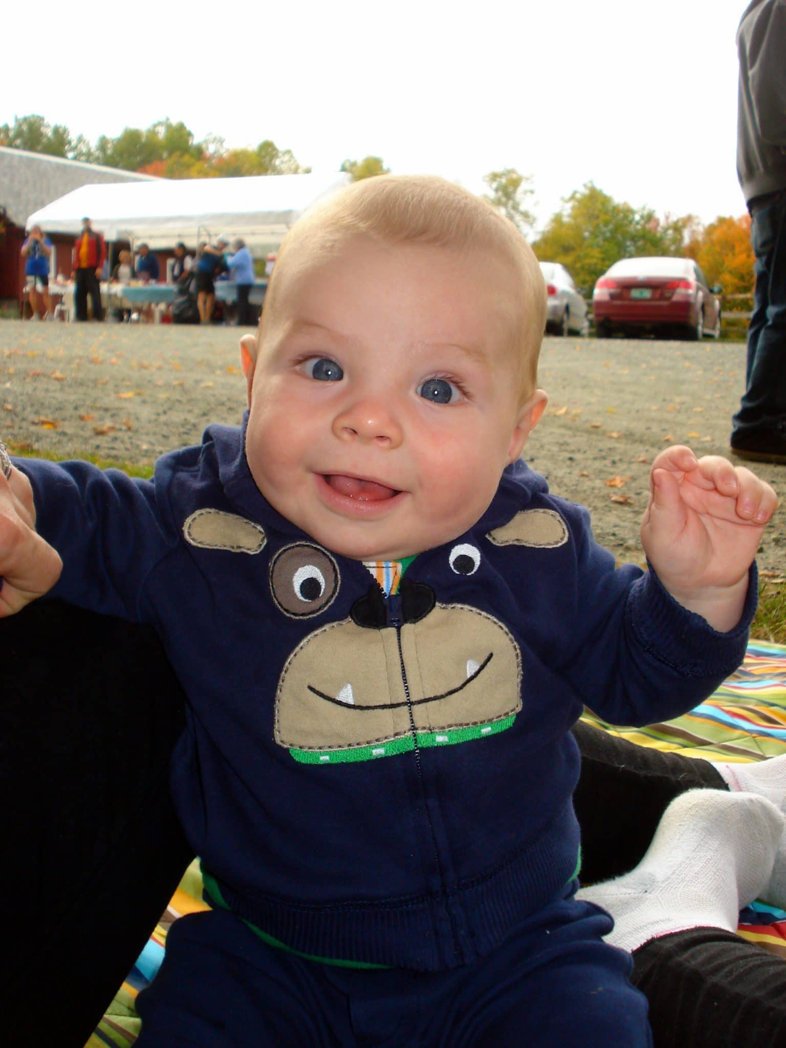 Happy baby (son) at race