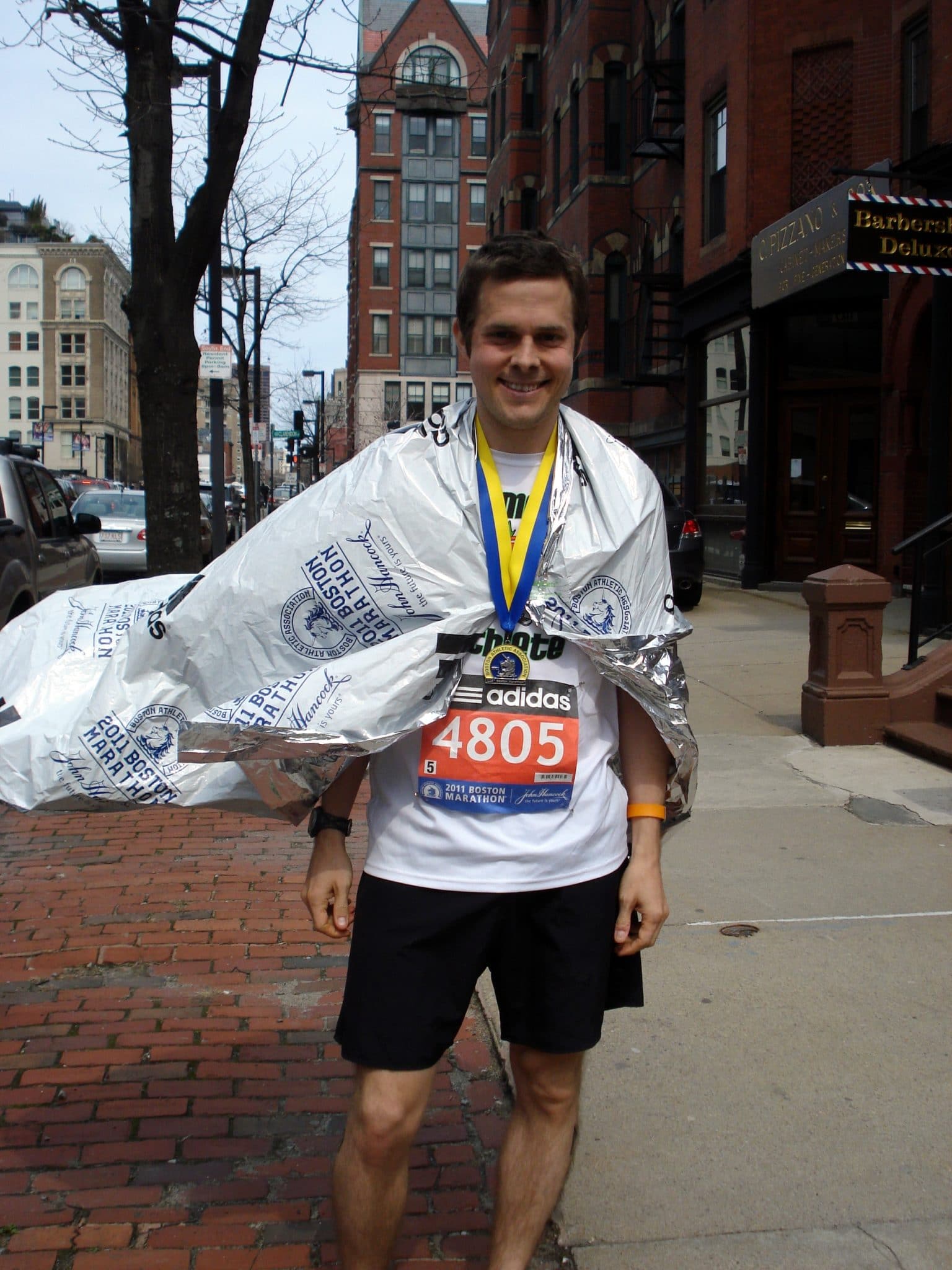 matt wearing finishers medal after completing Boston Marathon