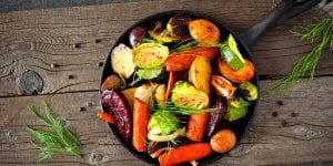 Cast iron skillet of colorful roasted vegetables